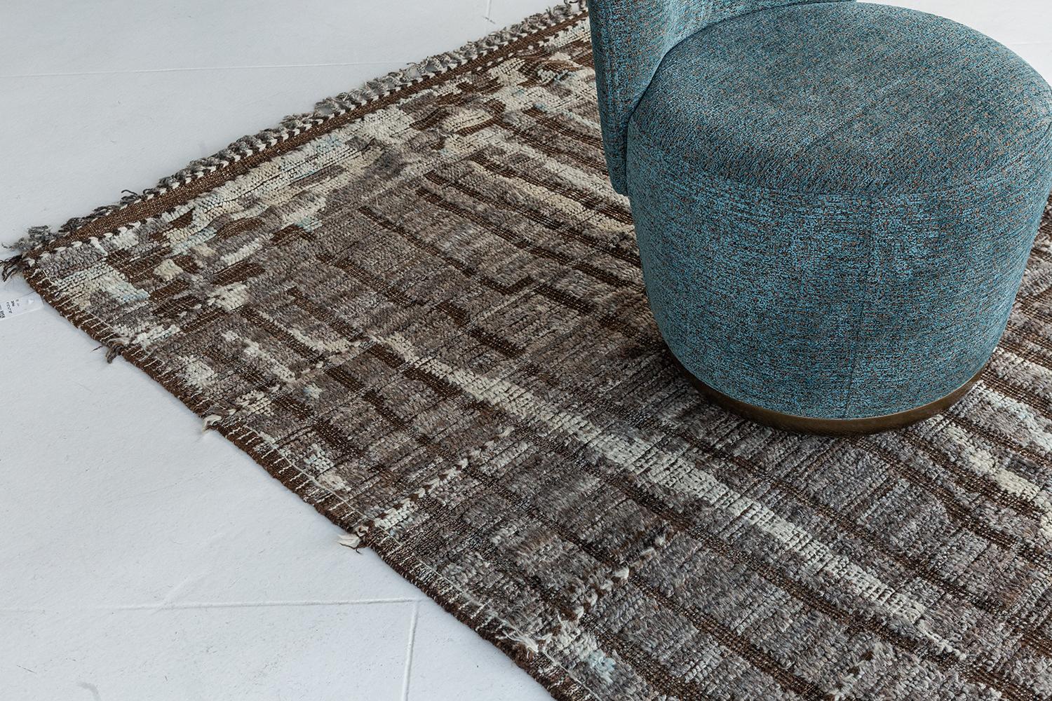 Berberis is an interplay between darker neutral tones and soothing muted colours into a modern day interpretation of the Moroccan world. This rug's play of textures, linework, and unique shapes is what makes the Atlas Collection so unique and sought