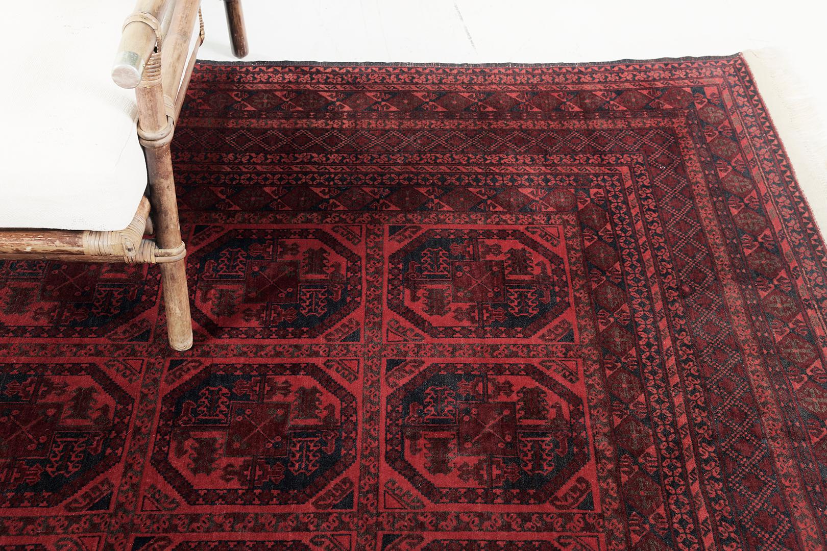 A ravishing Bokhara Design Rug that features a majestic panel design in the most captivating design scheme. It has an illuminating wine red colour palette that creates a breathtaking impact brought to its viewers. A mesmerizing rug that will