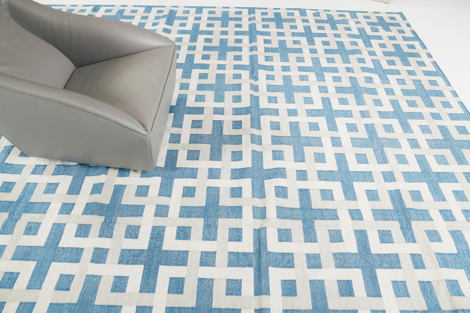 Estera’ in Peacock features an all over series of several stacked boxes interconnected to each element to form a stunning pattern that leaves a cohesive illusion to this mesmerizing masterpiece. Elegant yet compelling, this rug is rendered in the