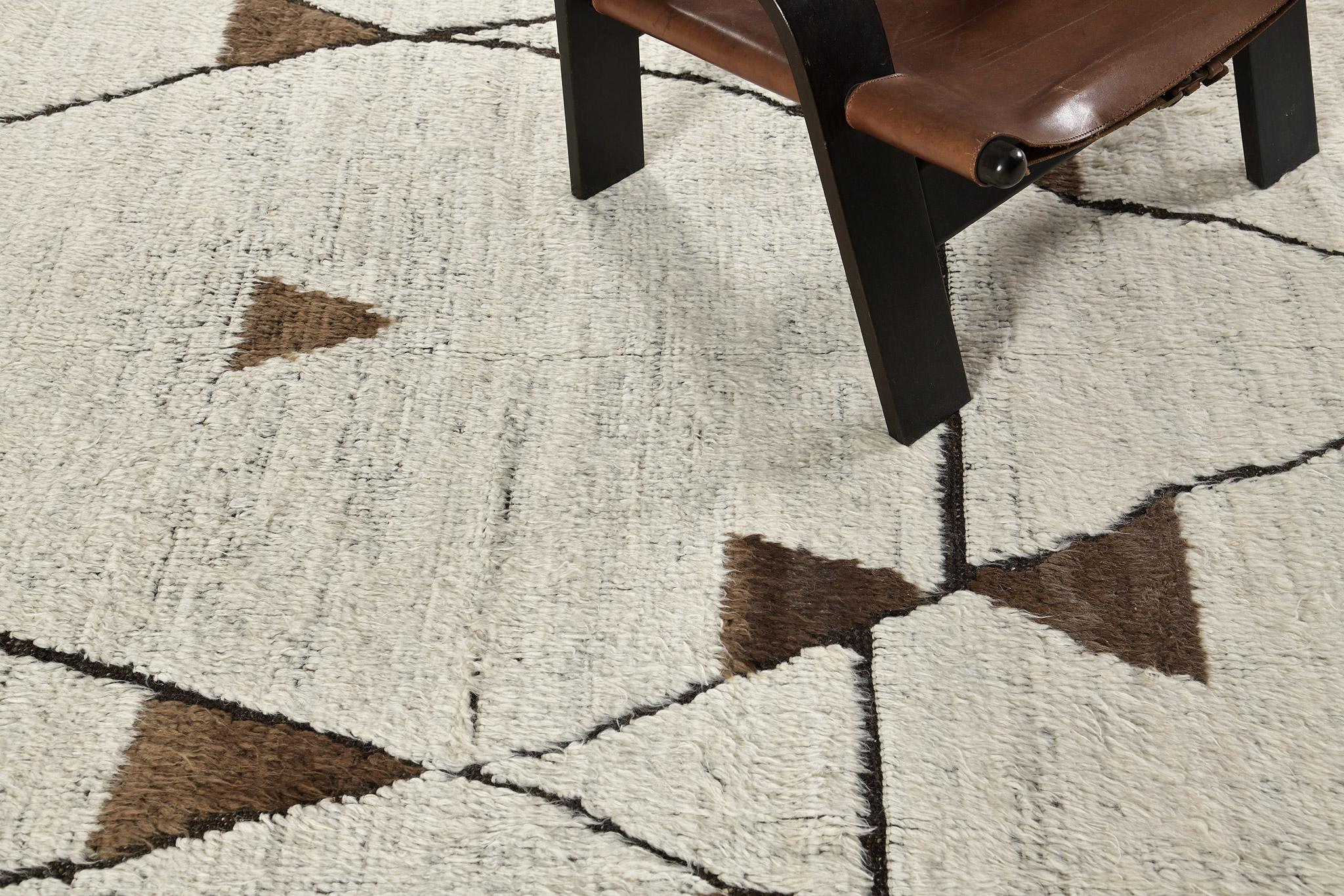 An alluring earth-toned Darbu rug from the Atlas Tribe of Morocco. This remarkable handwoven pile will add character to any room with its symbolic and geometric patterning. Modern contemporary interiors are the best fit for this masterpiece.

Rug