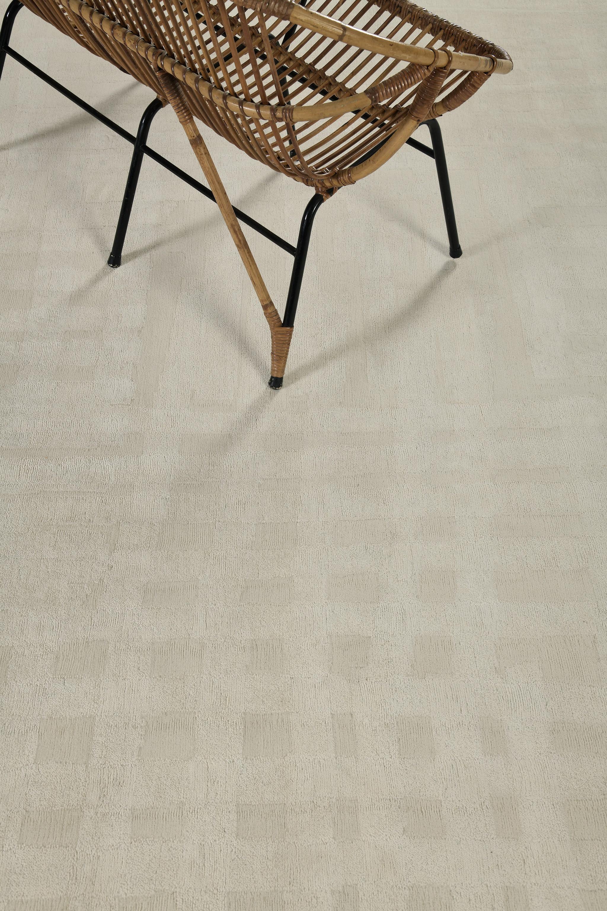 Due Volte is neutral-toned wool and silk that is inspired by various aspects of architecture. Featuring all the varying degrees of linear patterns, this stunning rug features a classy and sophisticated kind of decor. A timeless design that is