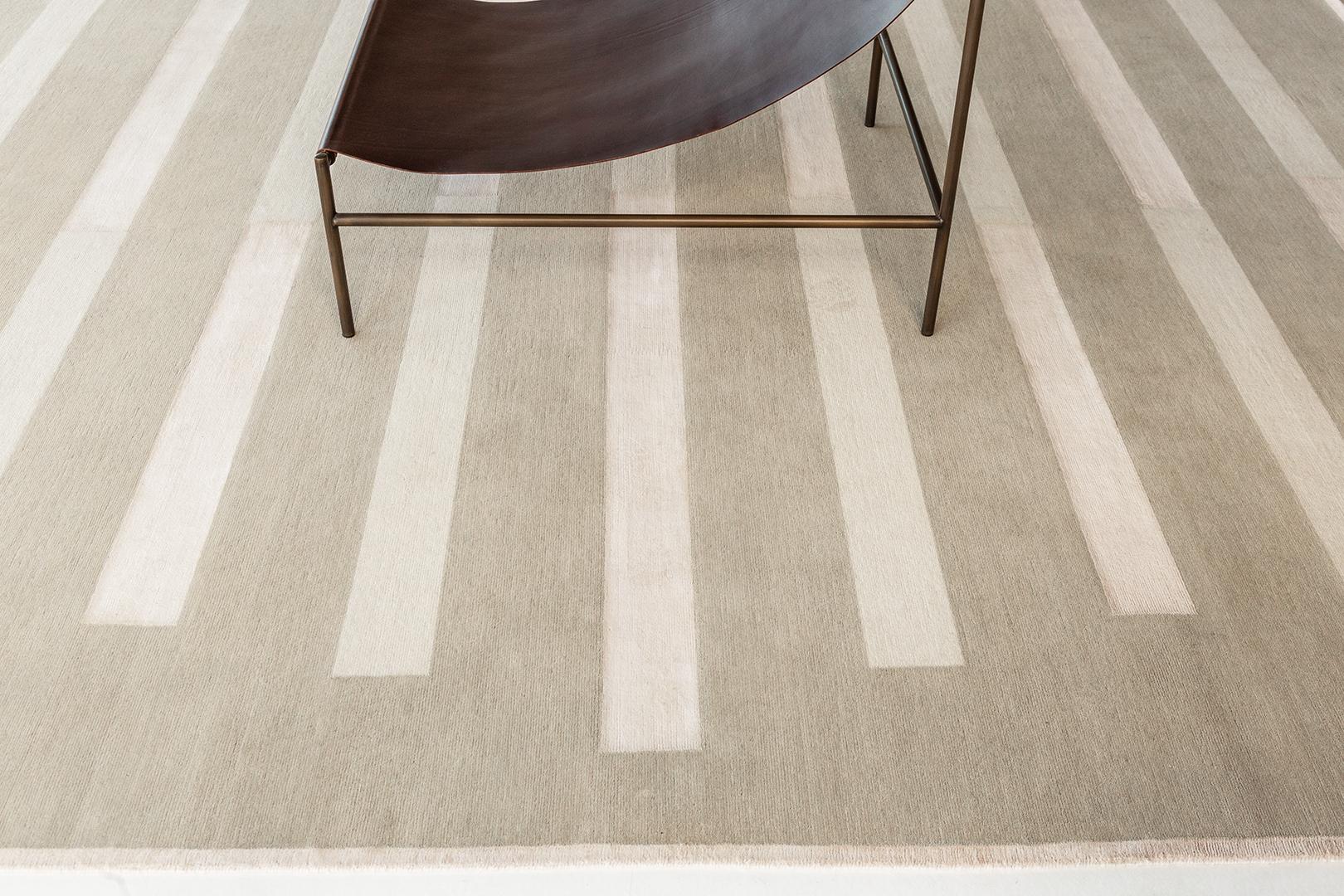 Entrée offers a classic grounding linear pattern, providing structure to any room. Simple transition from wool to silk in a singular line offers visual and tactile texture. Entrée is a study of linear composition and textural exploration.

Erica
