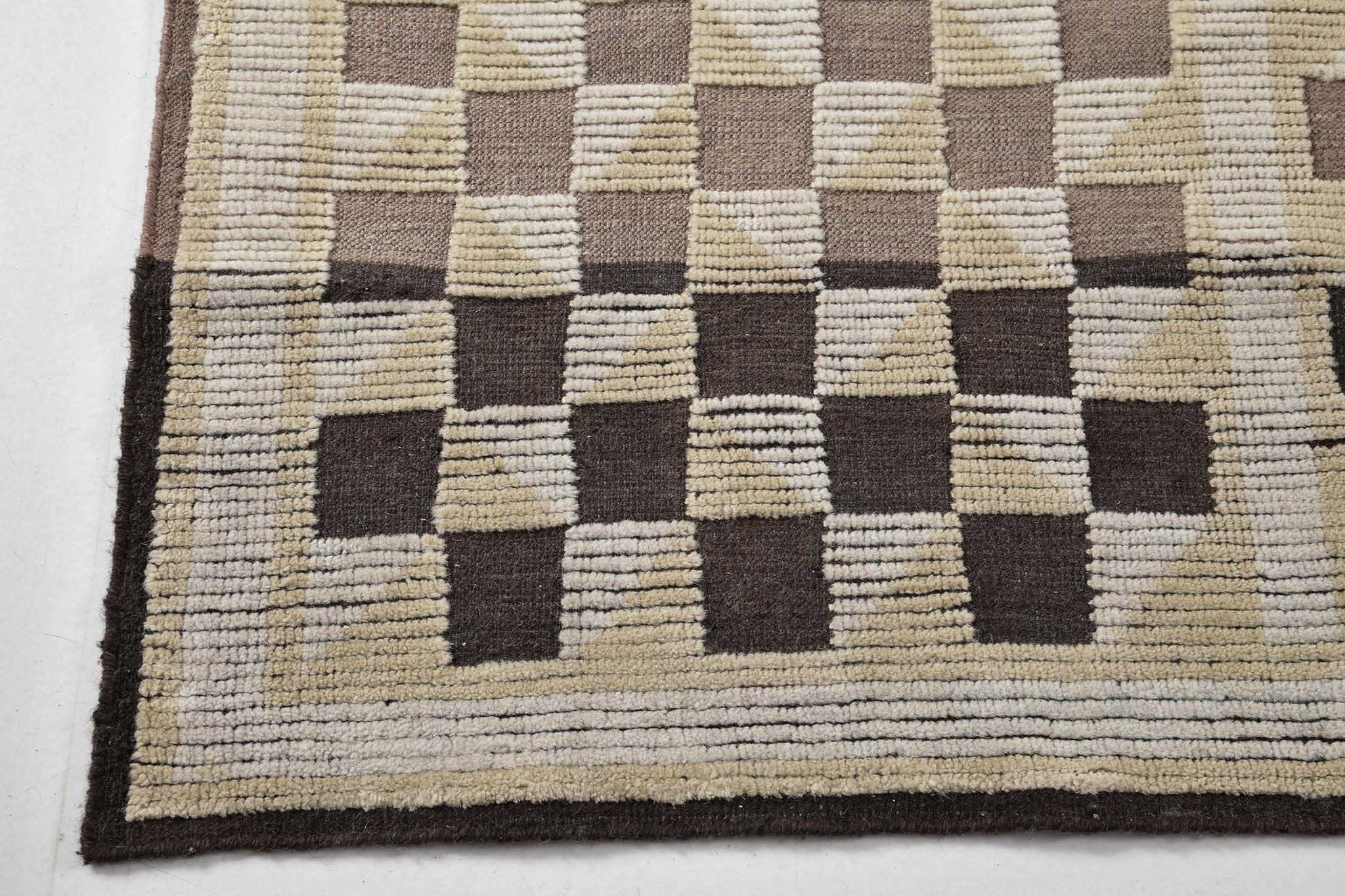 Franc' aus der Estancia-Kollektion zeichnet sich durch seinen Charakter und seinen Stil aus, indem er die karierten Motive des Paneels zeigt. Dieser bezaubernde Teppich zeigt atemberaubende erdige Farbtöne in einem Ombre-Effekt aus Umbra, Beige und