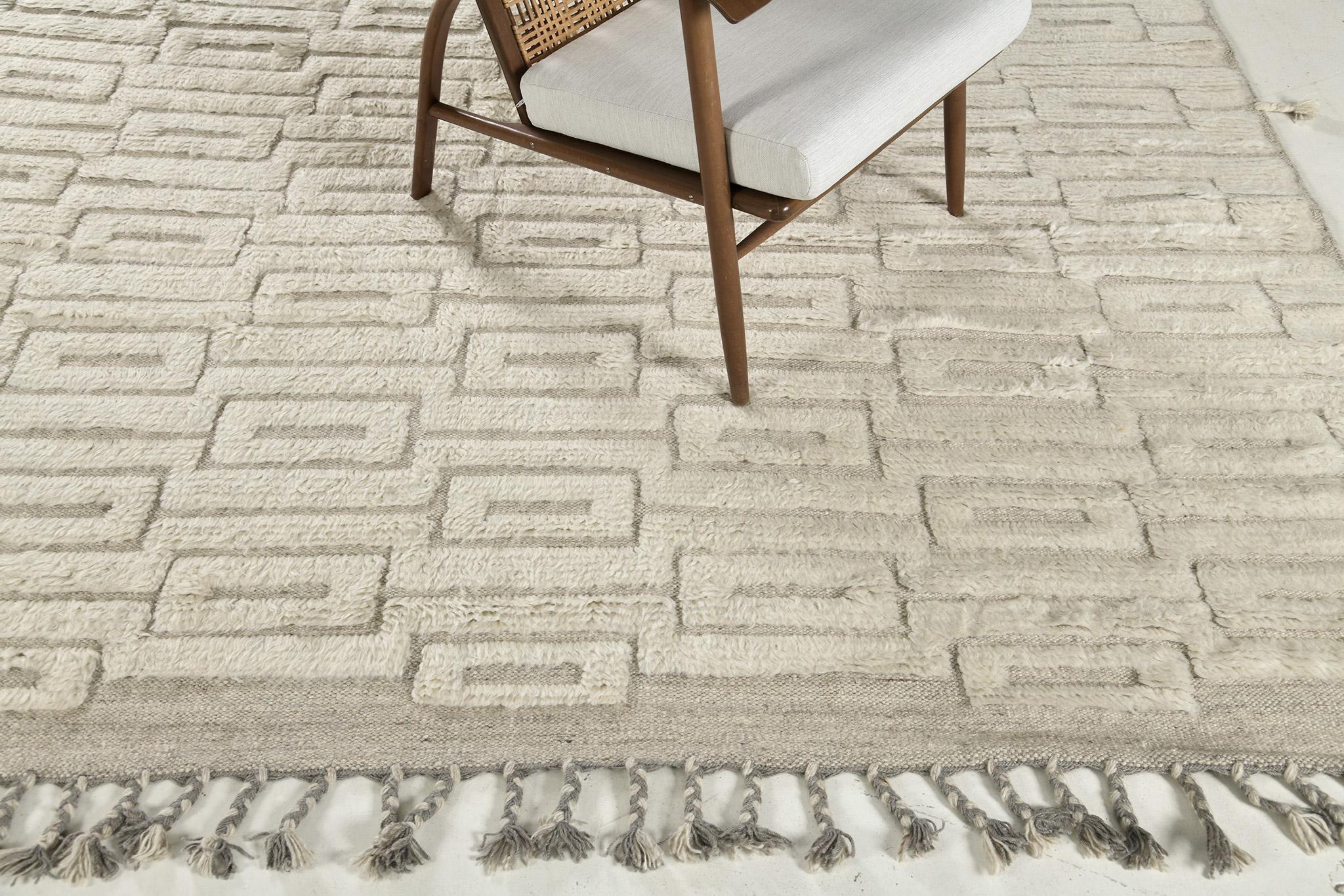 Gavle is a handwoven luxurious wool rug made of remarkable and straightforward design and neutral tones. Geometric patterns are featured in this masterpiece that can be put in any host application. The Haute Bohemian collection designed in Los