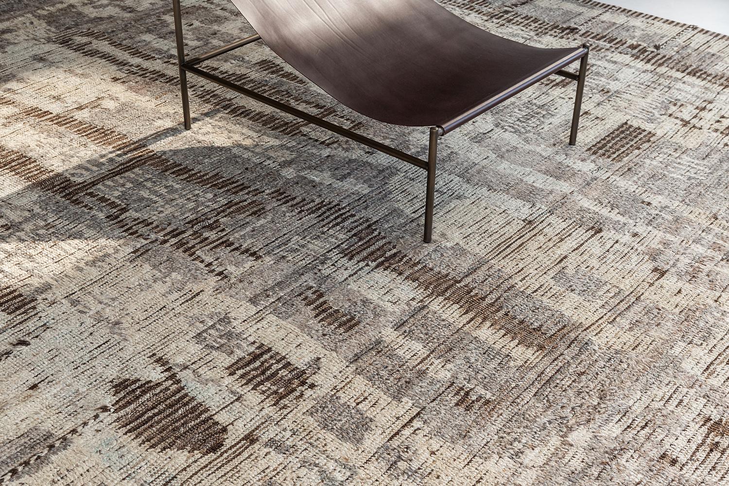 Halfah is a neutral-toned pile weave and modern-day interpretation of the Moroccan world. The rug's irregular shapes and strokes resemble the fibers of nature and their ability to be used for crafts such as cords and basketry. Designed in Los