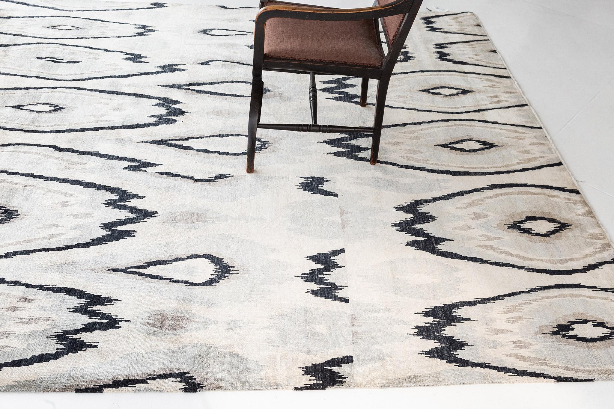 Ikat Design rug in Alacha showcases an all-over adventurous geometric Ikat pattern composed of organic shapes in different sizes creating a striking retro effect over the entire composition. Incorporating the plush and soft silk neutral colours into