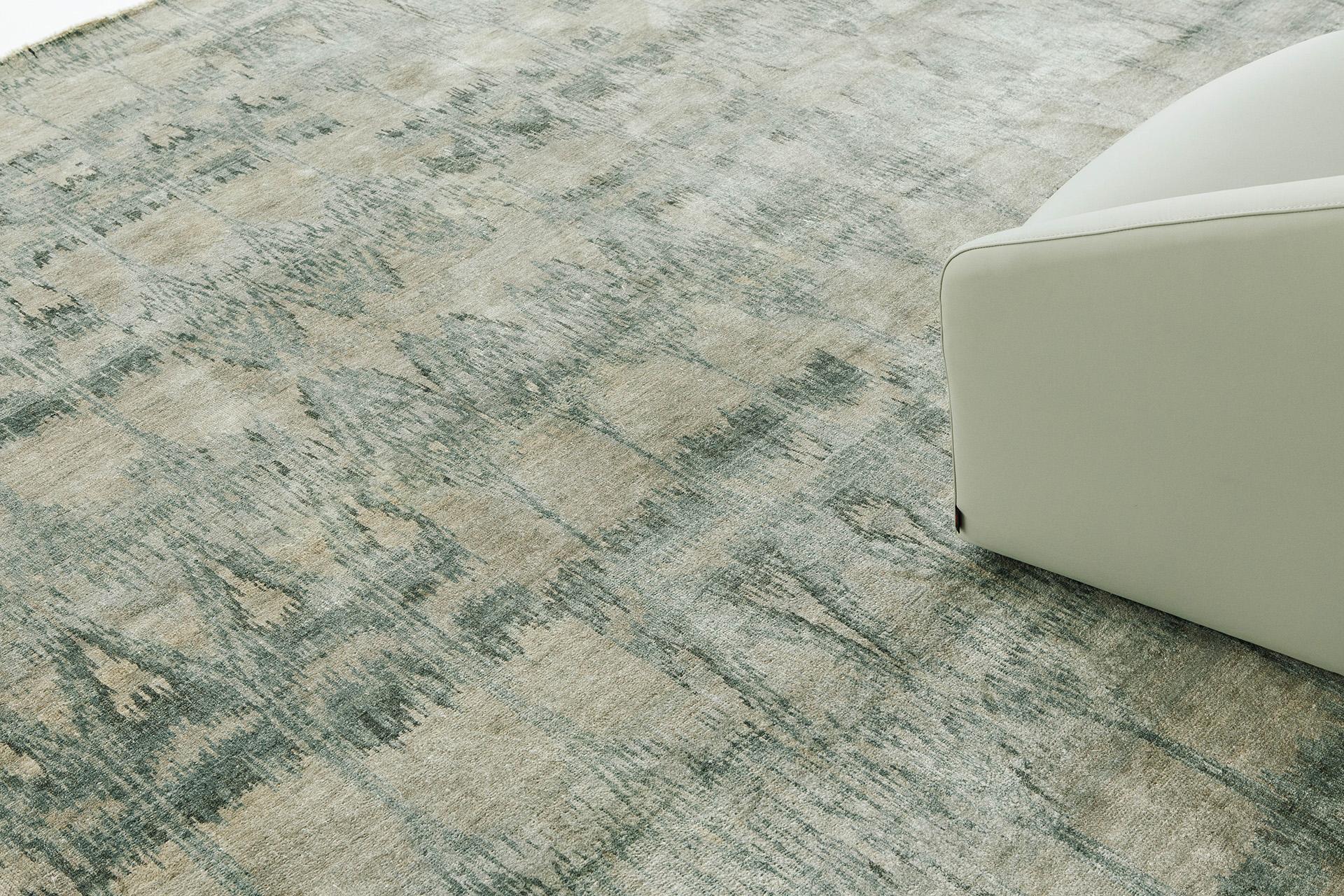 Arava' is a beautiful sage green Ikat design rug. This rug's attention to detail is quite exquisite and its silk pile weave is nothing short of luxury. Ikat designs have been globally inspired for today's modern design world.