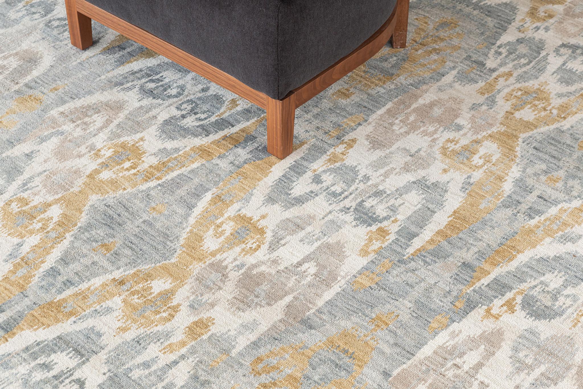 Harmonizing a tranquil and alluring style, this transitional Ikat rug in Tiraz elegantly displays a modern vibe. The abrashed field is covered in a repetitive Ikat pattern running along the ivory field. A perfect way to give your room a fresh,