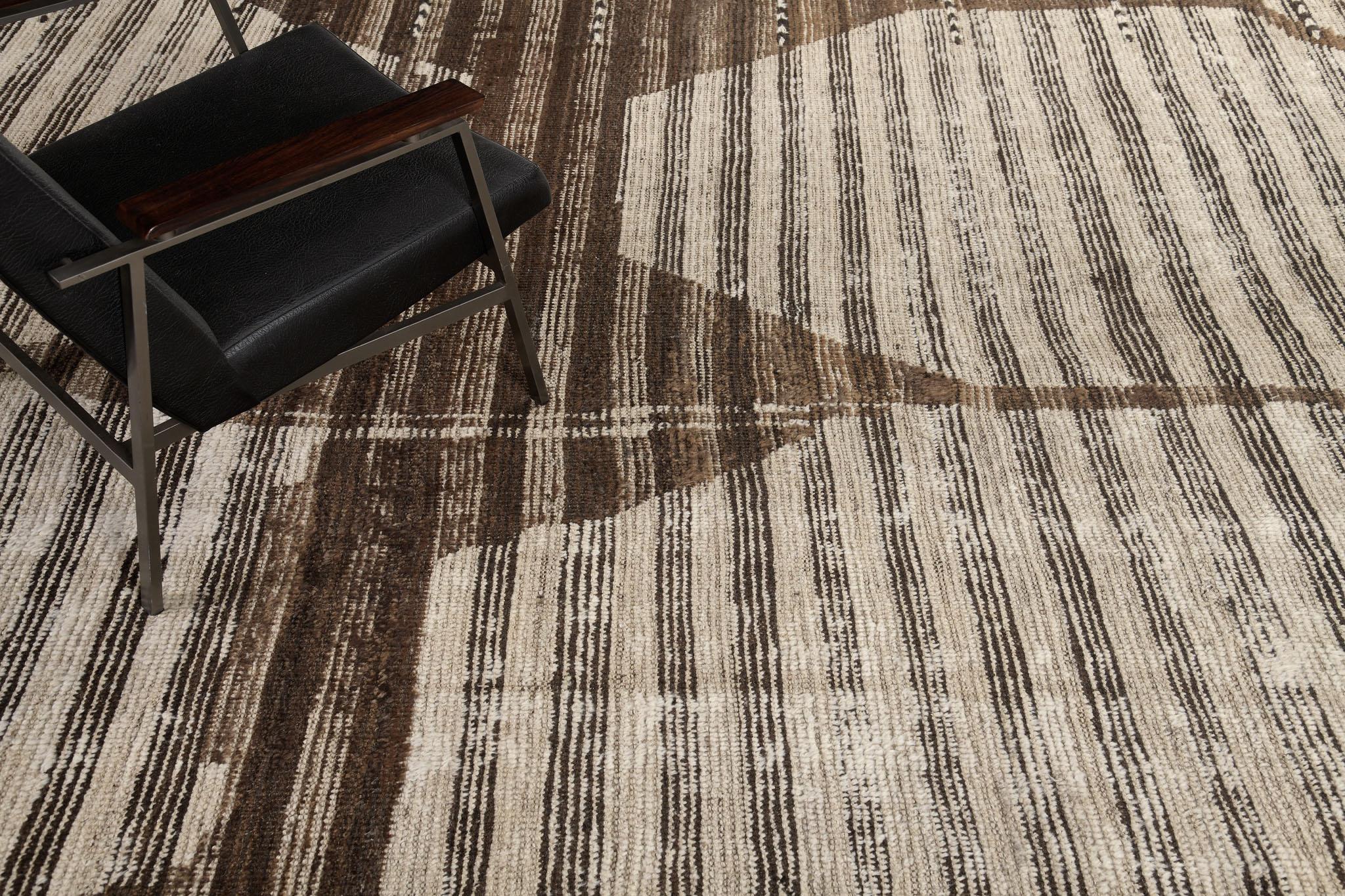 Jawahir is a neutral-toned rug that features irregular patches of cream and natural brown that is easy to match with other interiors. Designed in Los Angeles for the modern design world is a unique and lustrous design.

Rug Number 30919
Size 12'