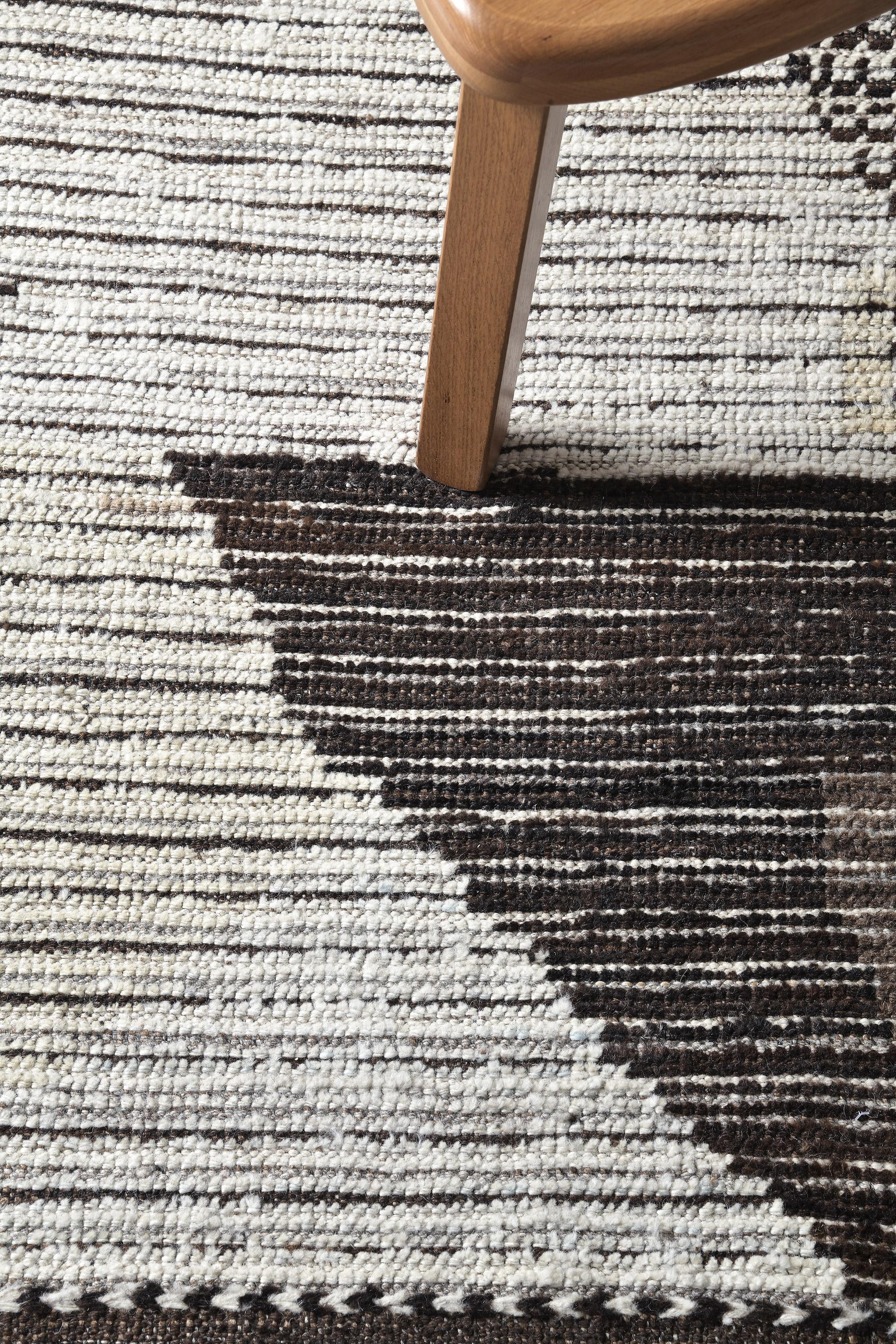 Kaouki' is made of luxurious wool and is made of timeless design elements. Its weaving of natural earth tones with mesmerizing colors and unique design patterns and shapes is what makes the Atlas Collection so unique and sought after. Mehraban's