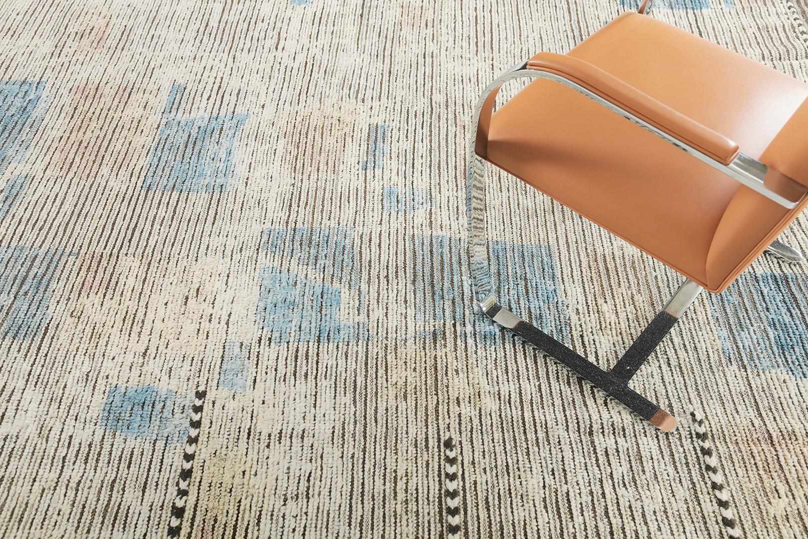 Kella displays an awe-inspiring sophisticated vibe that features azure blue patches that is spread fascinatingly along the textured earth toned rug. Borders accentuated by brown tassels brings out the welcoming vibe of this work of art. Mehraban's