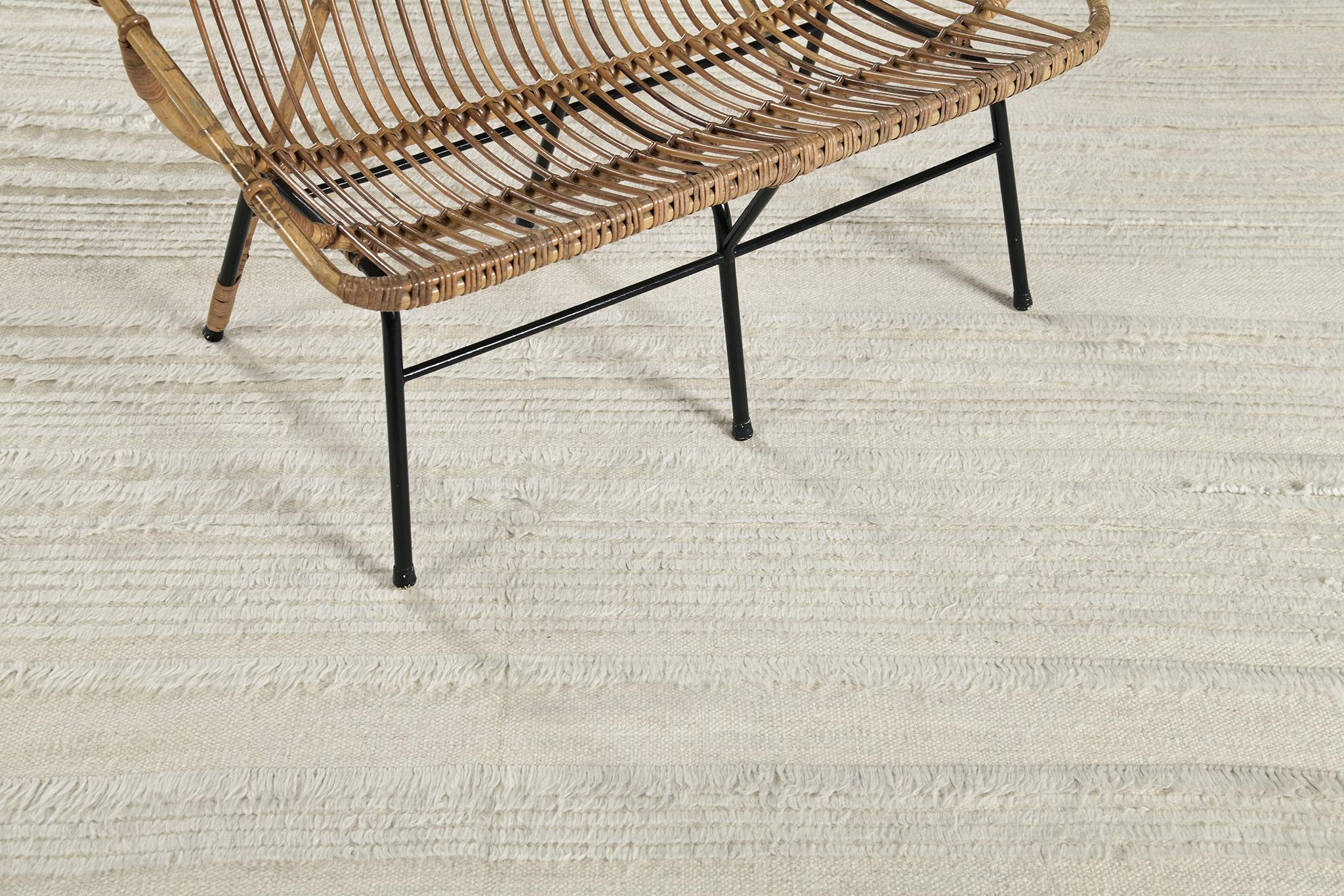 Kit Moresby II is luxurious wool that features embossed varying degrees of lines. Perfect decor for any home space because of its simplicity and modern-day interpretation. Mehraban's Atlas Collection is known for its intuitive motifs, saturated