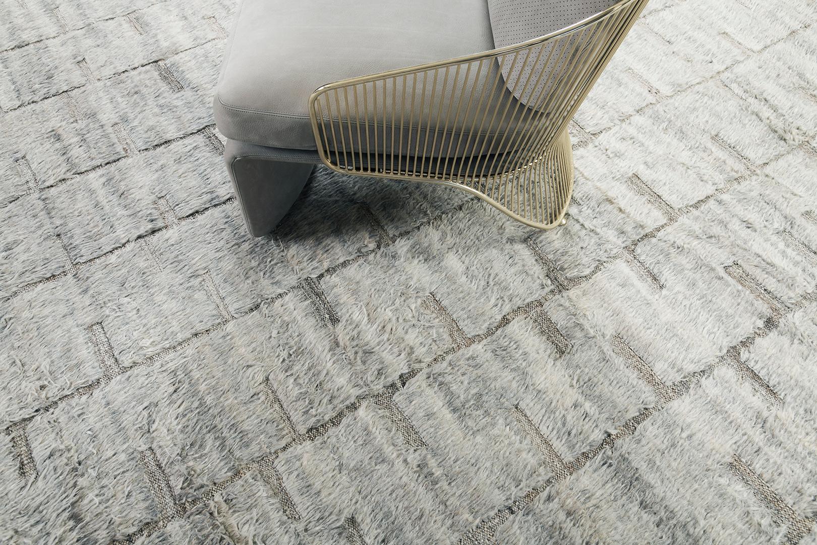 The signature collection of California. Handwoven luxurious wool rug, made of timeless design elements and natural earth tones with the perfect shade of ivory shag and fossil gray embossed pile weave. Haute Bohemian Collection: designed in Los