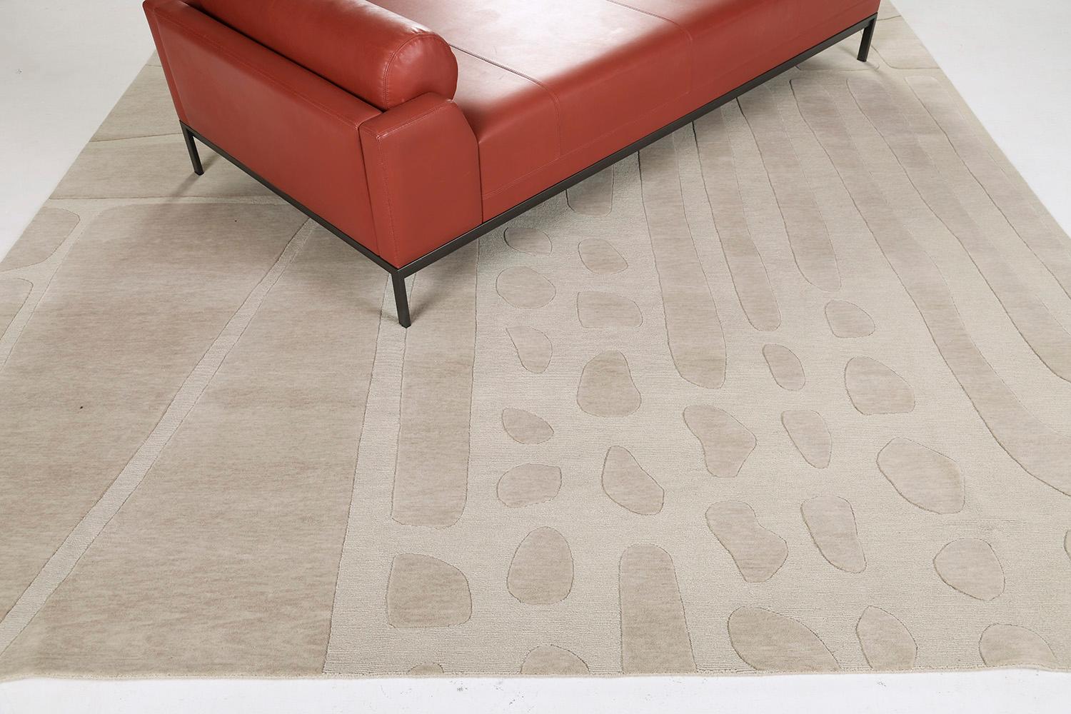 A large-scale composition of irregular wedge, rod and pebble shapes animated in the textural contrasts of loop and cut pile. Here in a soft taupe, tone on tone. Always customizable.

Rug Number
29344
Size
9' 0