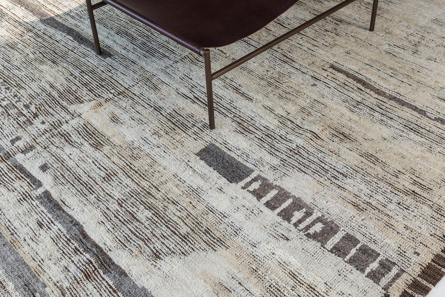 Malaren' is a luxurious wool rug with timeless embossed detailing. In addition to its perfect natural flat weave, Malaren has earthy tone shags that brings a lustrous texture and contemporary feel to one's space. With its plush pile, functional