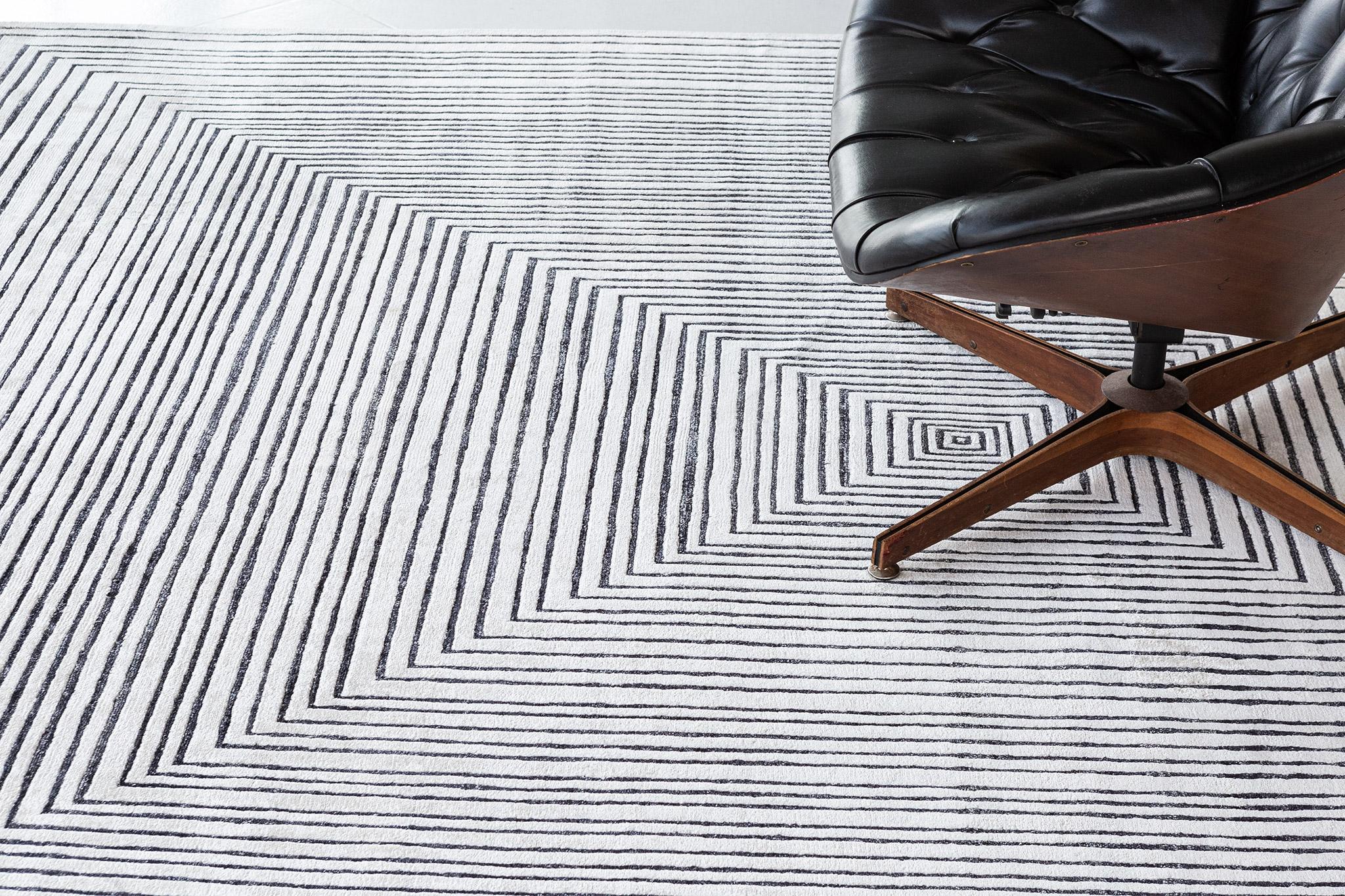 Masitawek is a bamboo silk rug that features an optical illusion of a rectilinear pattern. A contemporary and minimalist interior is a match for your modern room spaces. A centerpiece that will amaze your guests.

Rug Number
27582
Size
8' 1