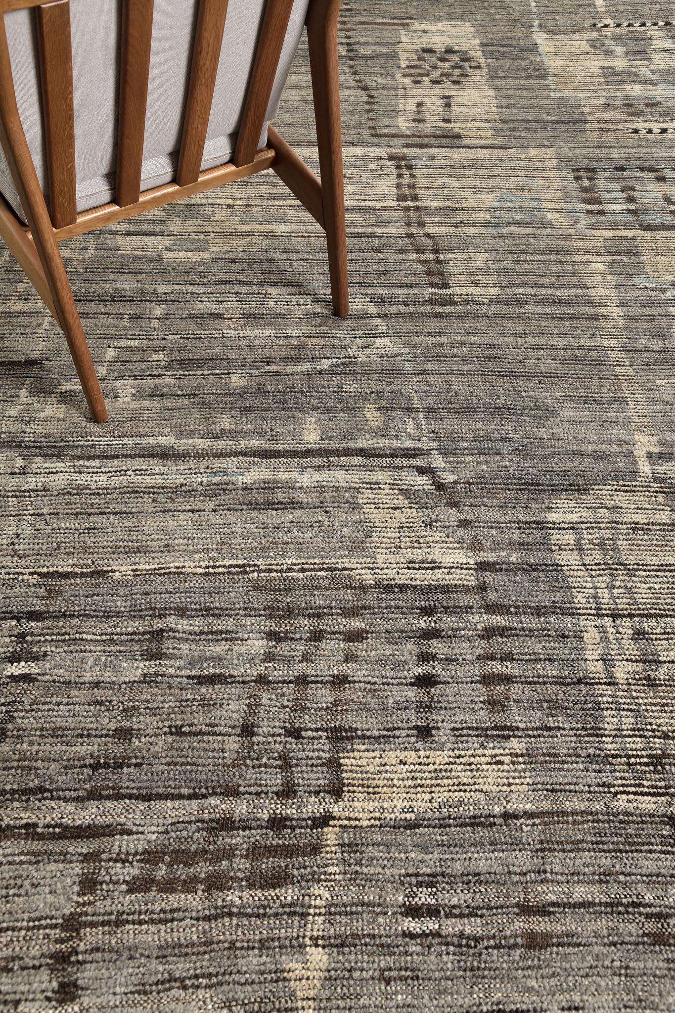 Meliska is a captivating textured rug with irregular motifs inspired by the Atlas Mountains of Morocco. Earthy tones of ivory, taupe, and chocolate brown surrounded by umber brown shag work cohesively to make for a great contemporary interpretation