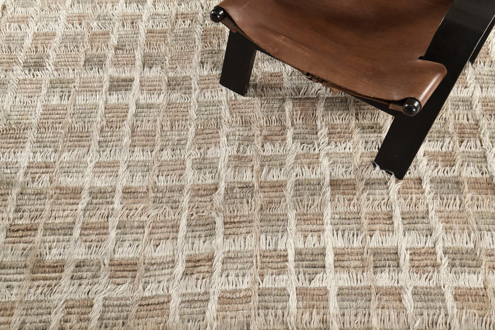 Miha highlights its cozy grid motifs that will surely captivate you into a sensational experience through its wonderfully textured rug. Featuring the mesmerizing shades of ivory, cinnamon and pale sage green, this exquisite rug is perfect for a wide