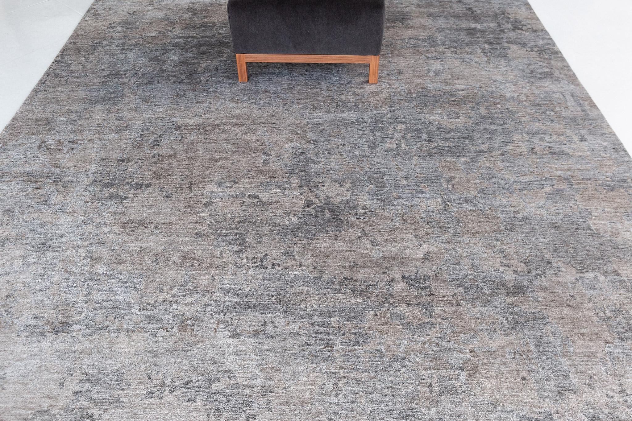 This remarkable Modern Design Bamboo Silk rug conjures up the spirit of Bohemia, with its playful smokey gray effect colors. It is just as trendy and refined at the same time, perfect for any connoisseur of a fine lifestyle.

Rug