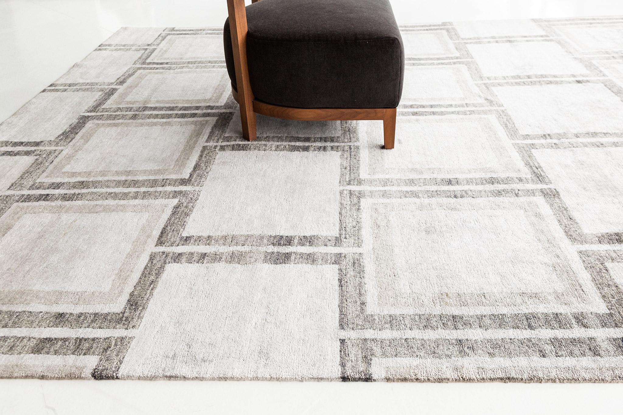 With its bold pattern and geometric aesthetics, this Modern Design Bamboo Silk Rug in Kista artfully embodies a transitional style. The field features a series of interconnected squares with rich abrash of softly gradated striations running along