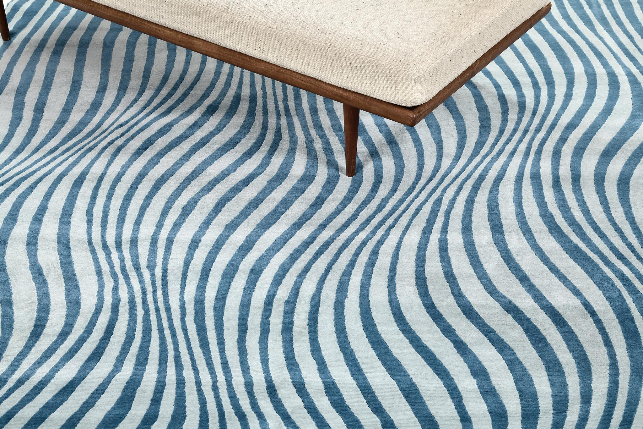 Un tapis au design moderne qui donne à votre espace une touche audacieuse et distinctive. L'effet d'ondulation donne au spectateur une impression d'illusion lorsqu'il voit ce tapis fantastique. Fantaisiste et en même temps séduisant, ce tapis