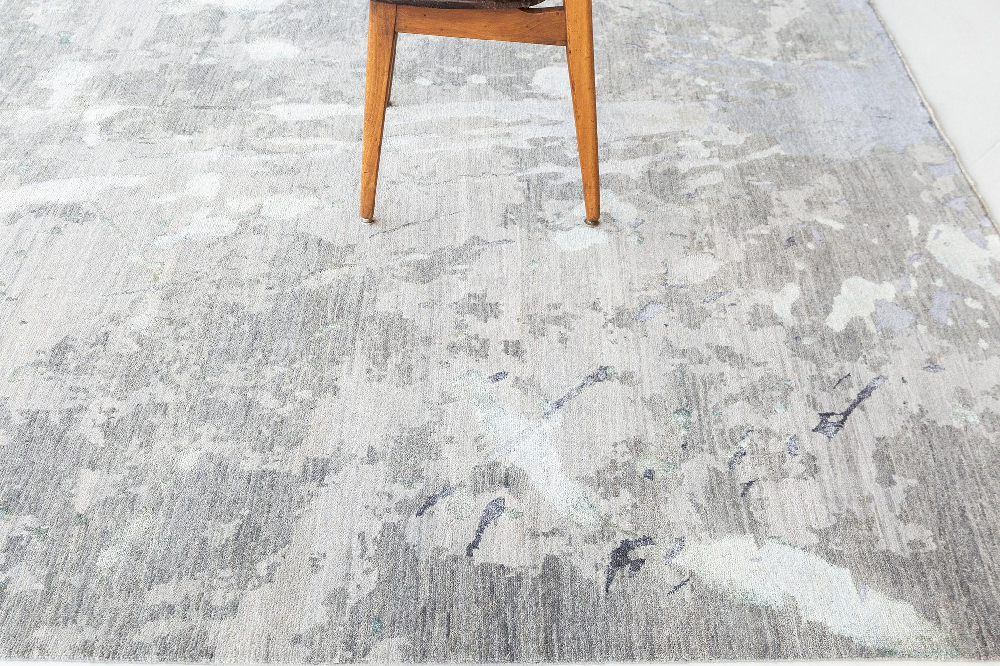 A splash of stunning muted colours and cozy contentment with this wool and silk transitional rug. Showcasing an expressive yet subtle design, incredible detail and texture, this modern design Spruzzo is a captivating vision of woven beauty.