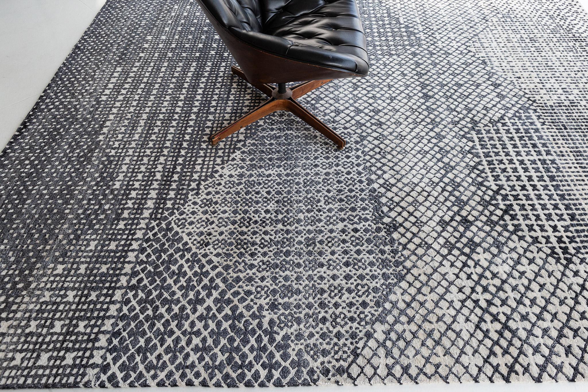 This magical Modern Design Bamboo Silk rug features the horizontal strokes, with its playful combination of charcoal and gray dominant colors. It is just as trendy and refined at the same time, perfect for any connoisseur of a fine lifestyle.

Rug