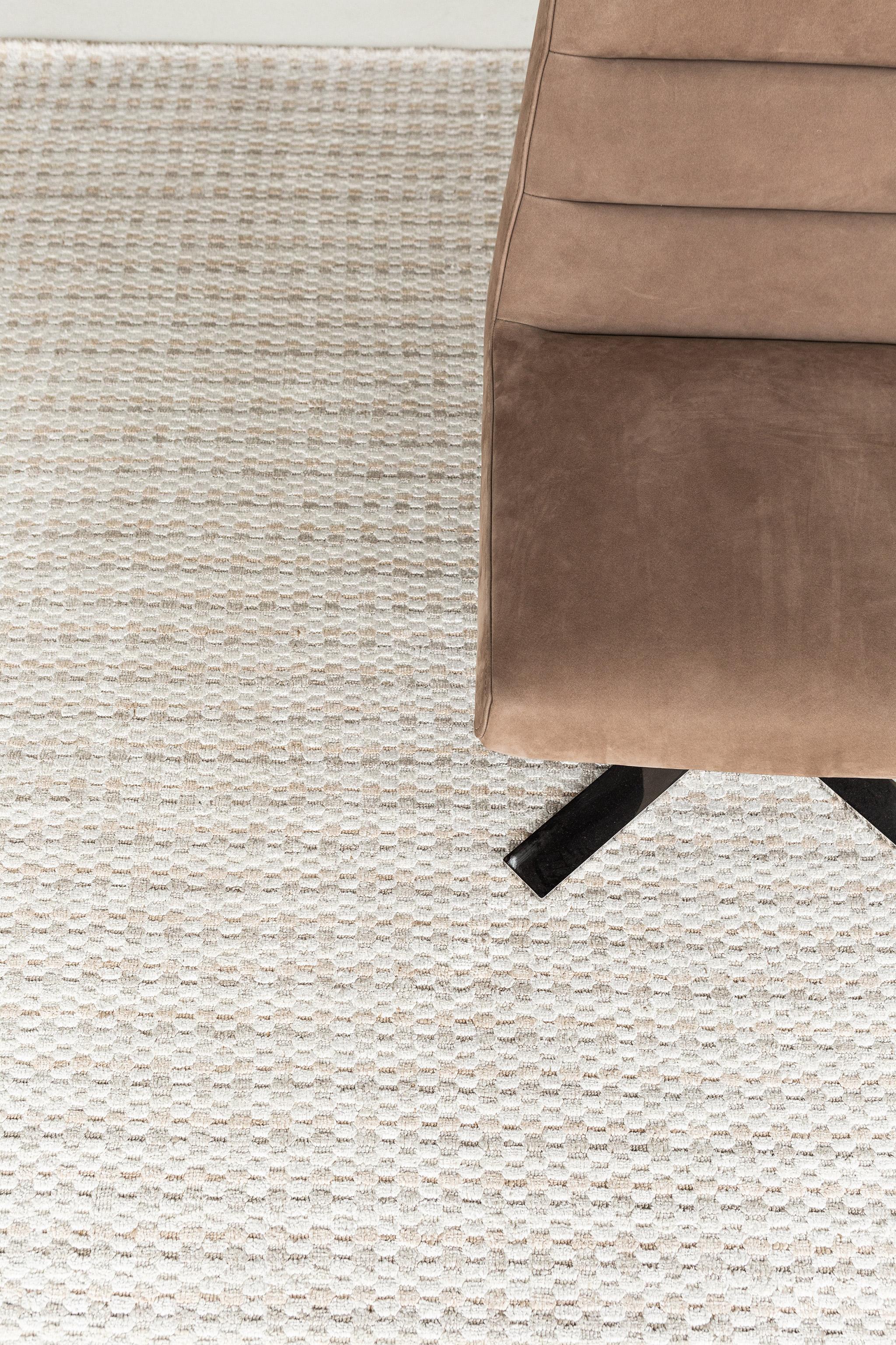 A captivating modern hand loom rug in our Luca Collection. The delicate checkered and ribbed style rug with neutral tones give it a sophisticated and beguiling feel. Repeating pile detailing also brings a bold and noteworthy uniqueness to this