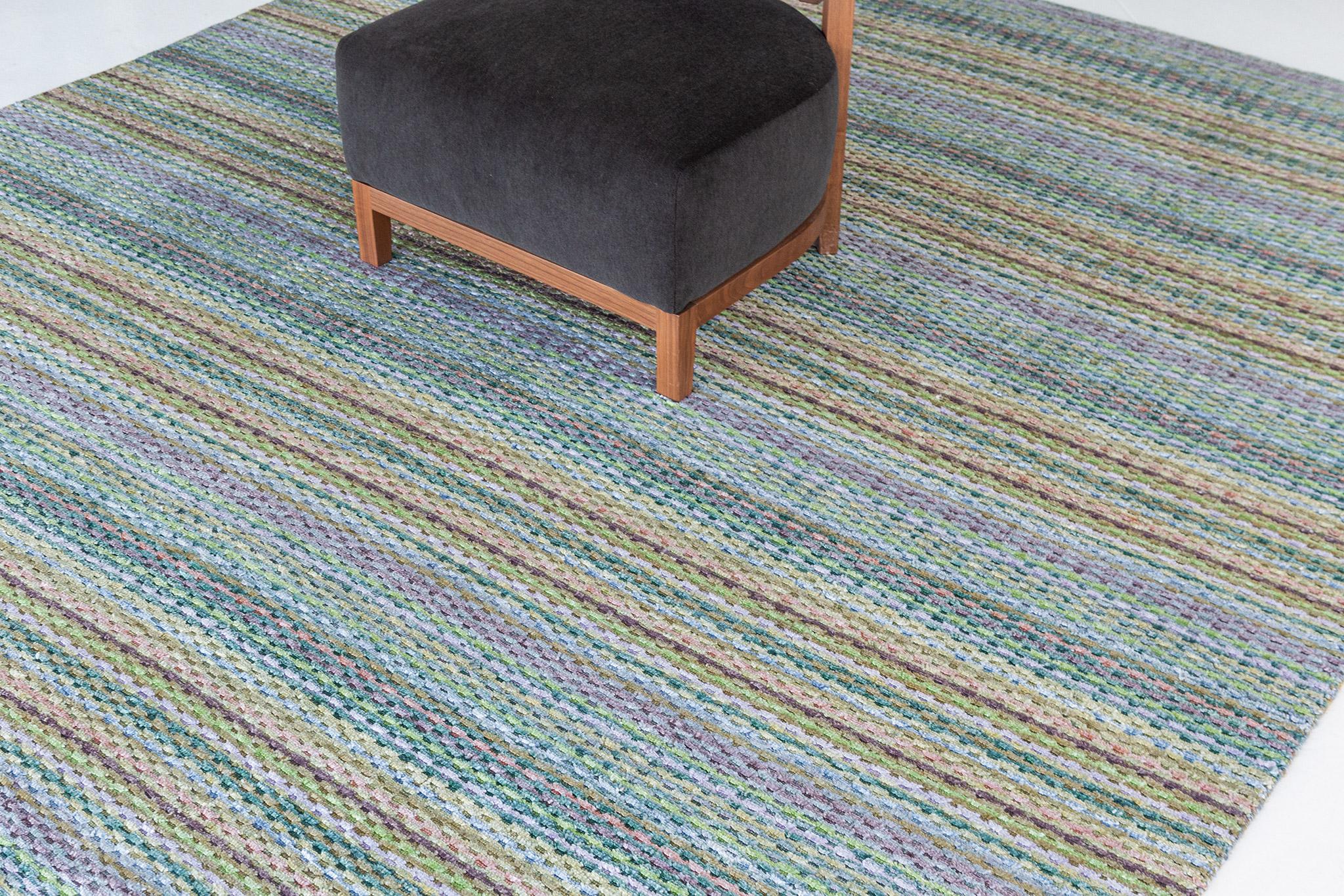 A fascinating modern hand loom rug in our Luca Collection. The delicate ribbed style rug in vibrant tones of green and yellow give it a sophisticated and festive feel. Repeating pile detailing also brings a bold and noteworthy uniqueness to this