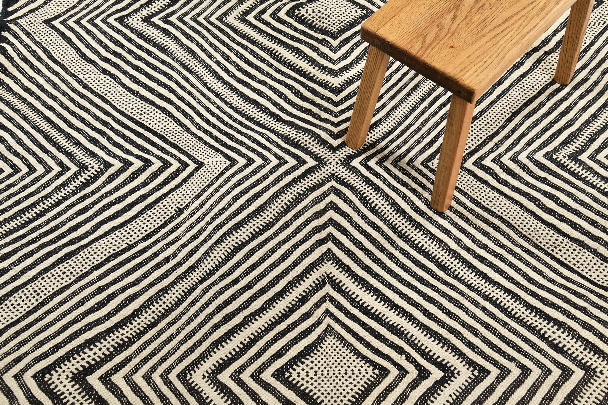 This incredible Moroccan Rug features an optical illusion creating a continuous diamond pattern that adds texture and flavor to the eyes of the guests. An effect that is the perfect complement to your home scenery with a minimalist accent