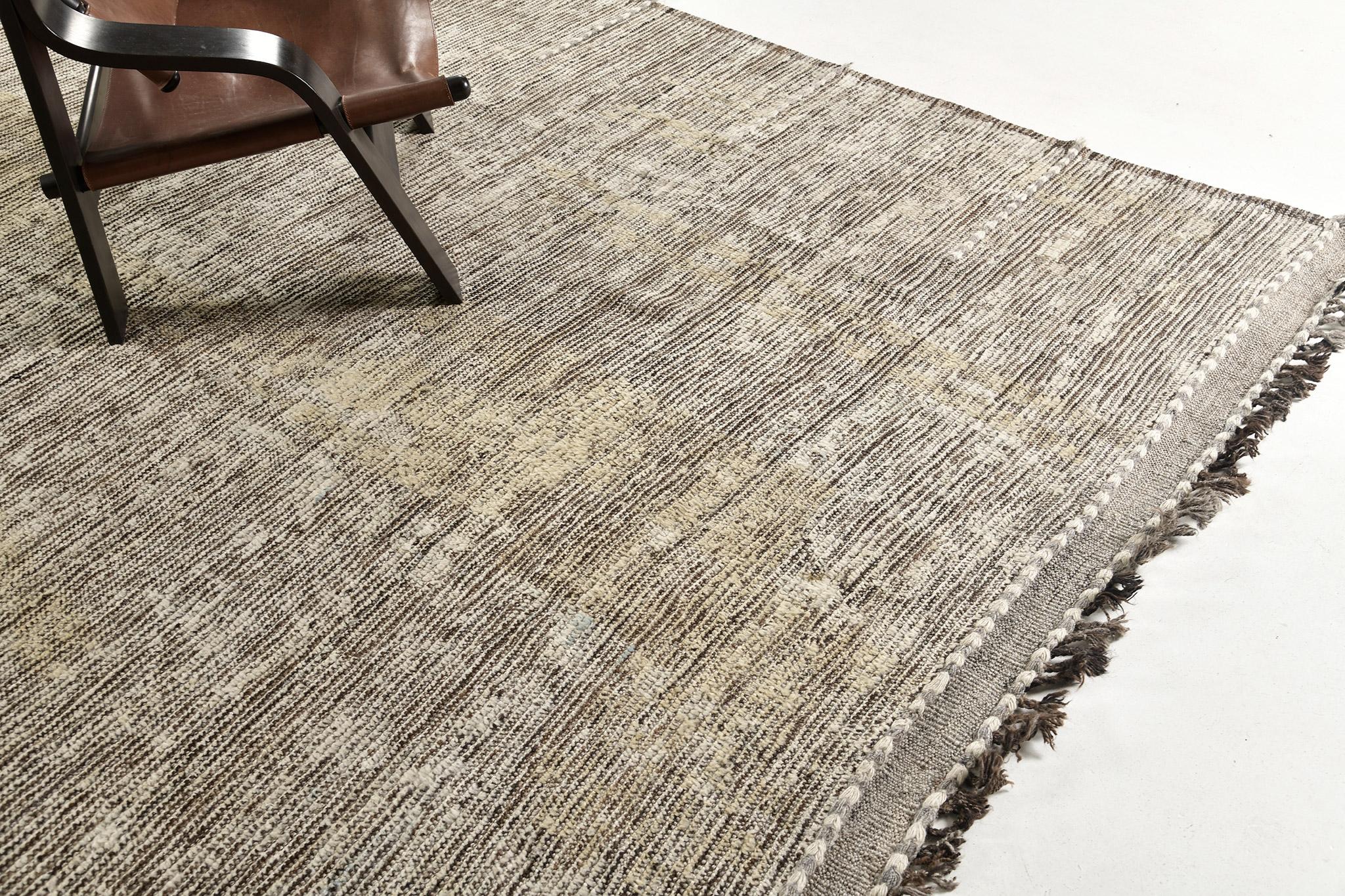 Nakhla is a natural earth-toned rug and a modern interpretation of the Moroccan world. These rugs' variegated tones of cream, brown, and gray resemble the fibers of nature and their ability to be used for crafts such as cords and basketry. Designed