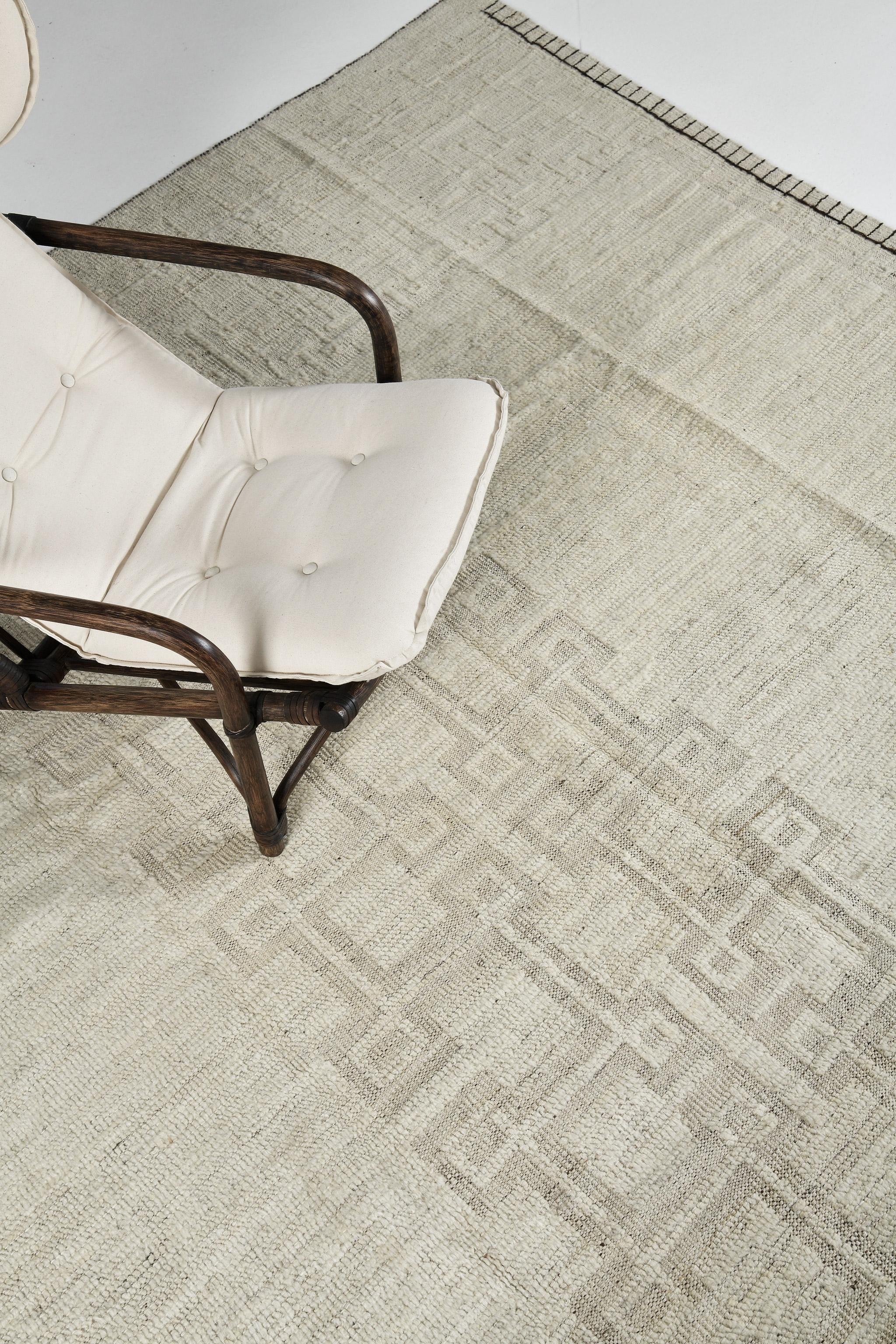 Natir in Nomad Collection features symbolic elements running along through the center in this stunning rug. Featuring the washed effect of ecru and taupe colour scheme, this amazing rug oozes elegance. With its sophisticated vibe, this rug is a
