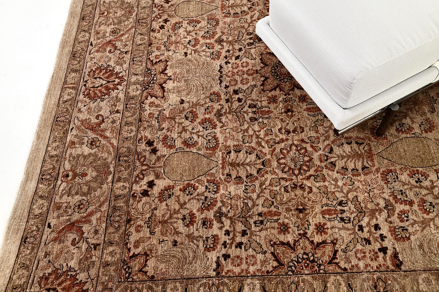 This magnificent revival of Persian Tabriz Hadji Jalili Rug has a mirrored pattern of the symmetrical elegant floral scroll and a softened ambiance of sand with symmetrical motifs of borderlines.  This masterwork of art utilizes neutral tones to