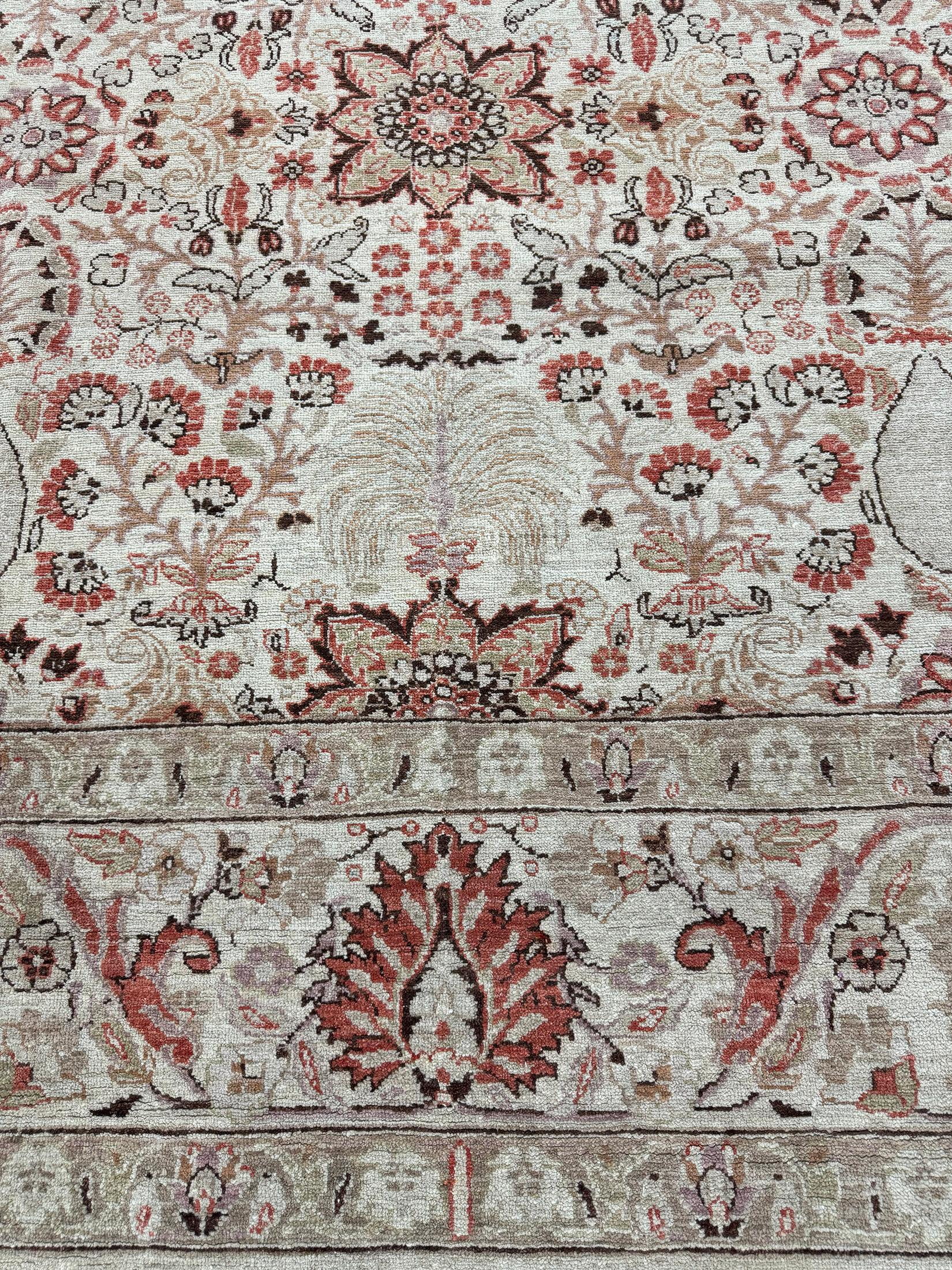 This magnificent revival of Persian Tabriz Hadji Jalili Rug has a mirrored pattern of the symmetrical elegant floral scroll and a softened ambiance of sand with symmetrical motifs of borderlines.  This masterwork of art utilizes neutral tones to