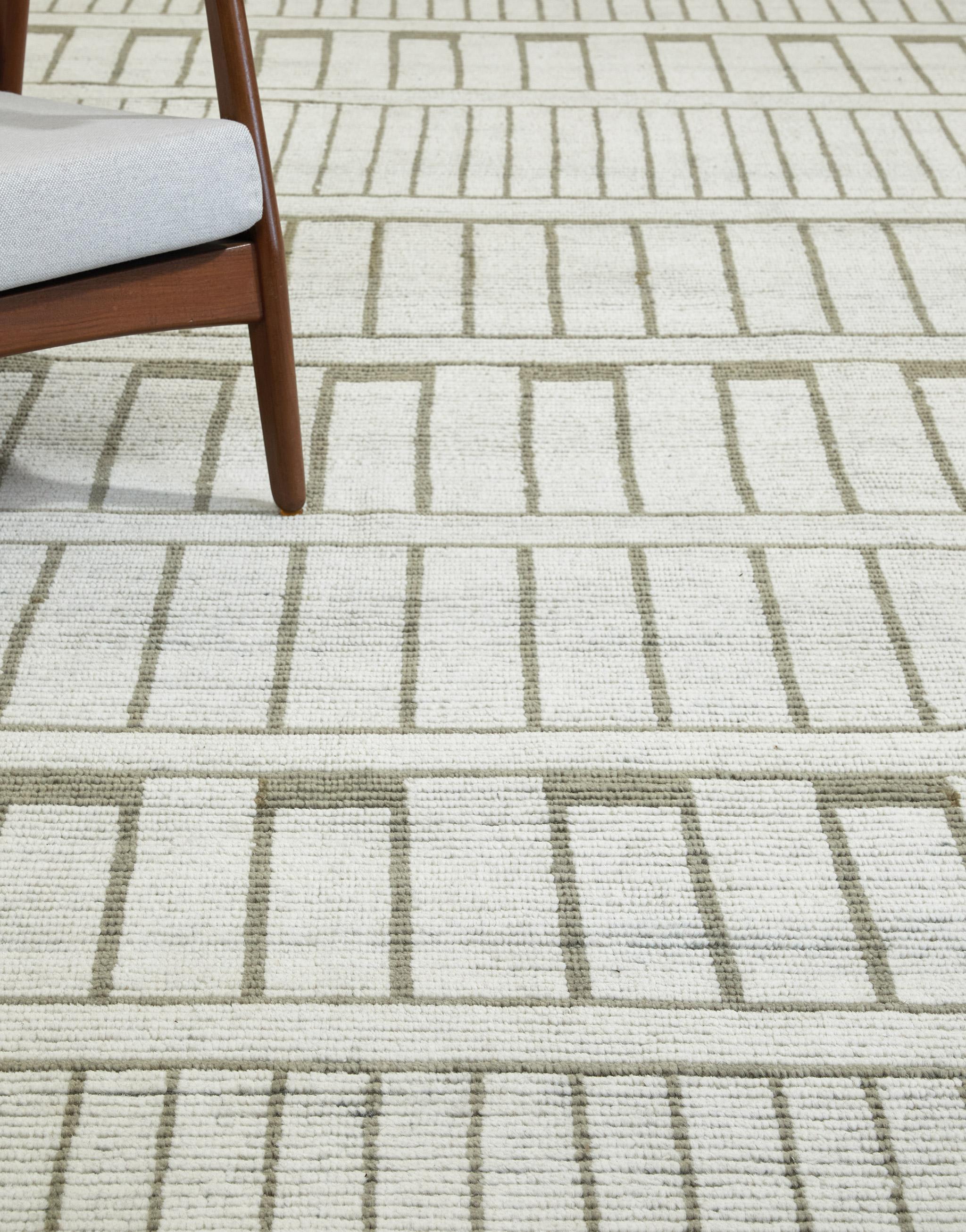 Nebbiolo is a geometric design rendered in trim knots with a contrasting flatweave underlay. Its near-ordered motif conjures fluting, dentils, bookshops…

Here in a ivory with olive.

The Estancia Collection by Mehraban is a group of casually