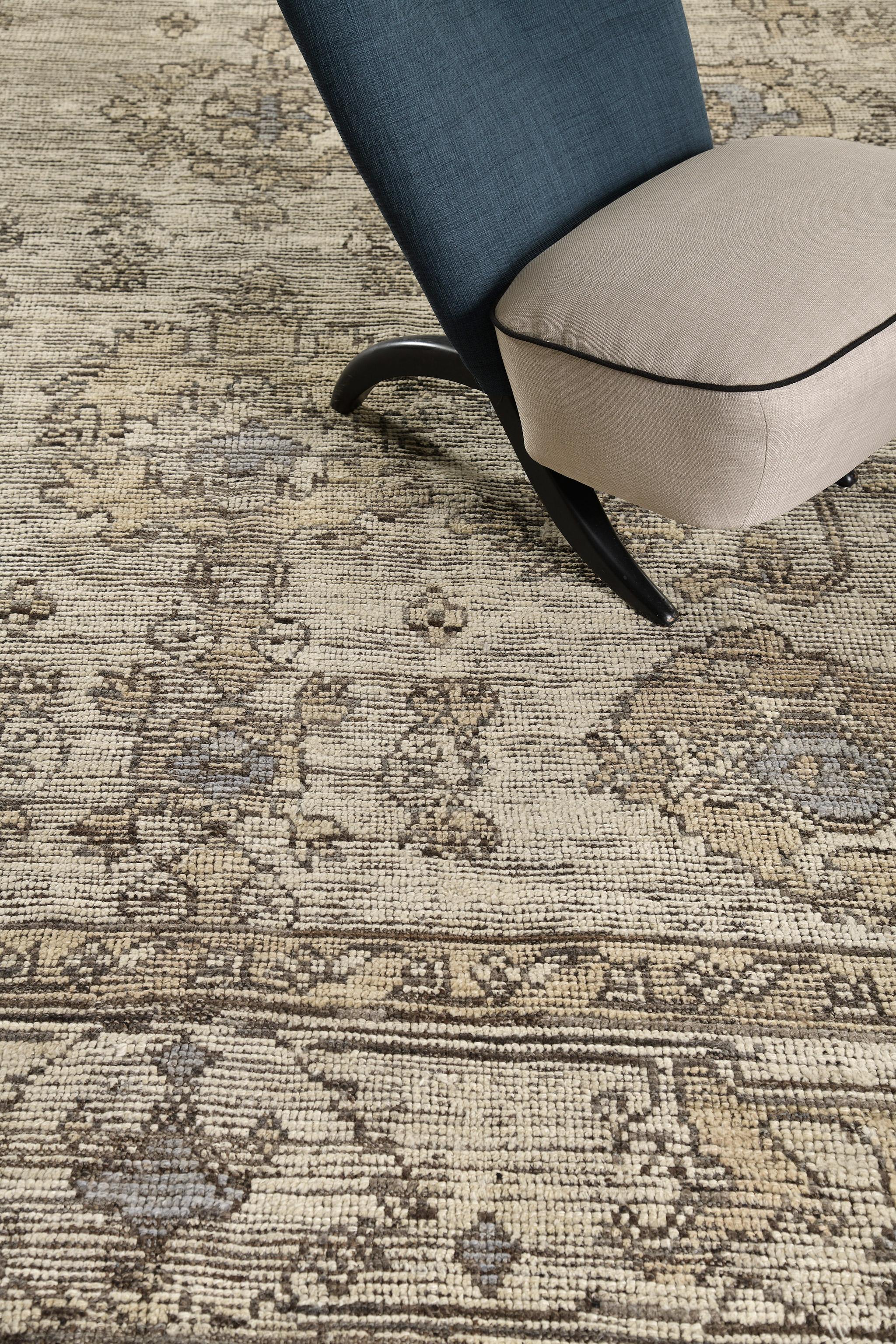 A captivating Oushak revival rug that is a magnificent translation of dainty sophistication. Distinctive palmettes, and florid patterns are showcasing remarkable radiance in the stunning shades of beige and camel enclosed by a fascinating