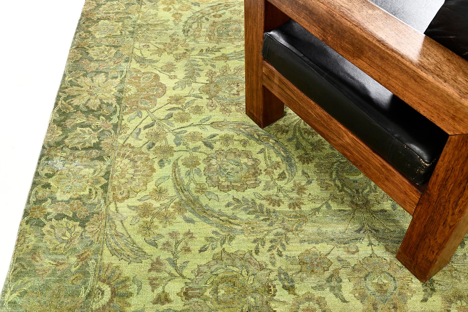 Be stunned by putting this sophisticated Agra Rug from our collection that is made from overdyed wool. A mirrored pattern is well placed together with sets of medallions, blooming floral patterns, majestic palettes, and vines within its lime field.
