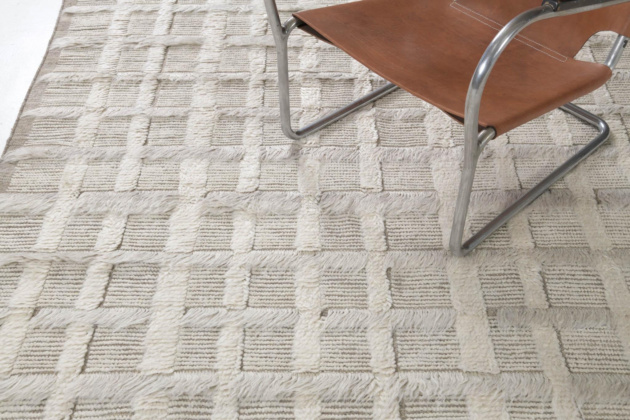 This Persian Jejim Kilim is a banded flat weave with alternating hues of cream, khaki, and clay brown in multi-column stripes. Persian flatweaves are made up of some of the best wool and weaved exceptionally to create interesting textures. This