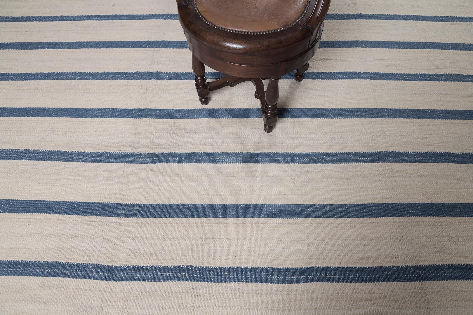 Persian Jejim Kilim is striped with a prussian blue linear pattern in a cream flat weave wool. These patterned rugs look beautiful and ideal for every modern and contemporary interior. 


Rug Number 27250
Size 11' 1