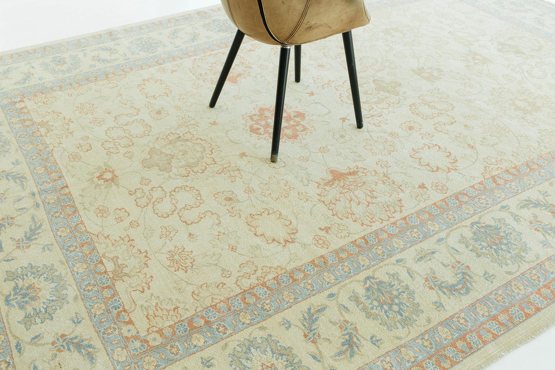 A modern, desirable Persian Sultanabad rug typically has a charming facade. This hand-knotted rug features the finest color shades of cream and tan, accented with morning blue and redwood for pattern detailing. This classic rug will look great in a