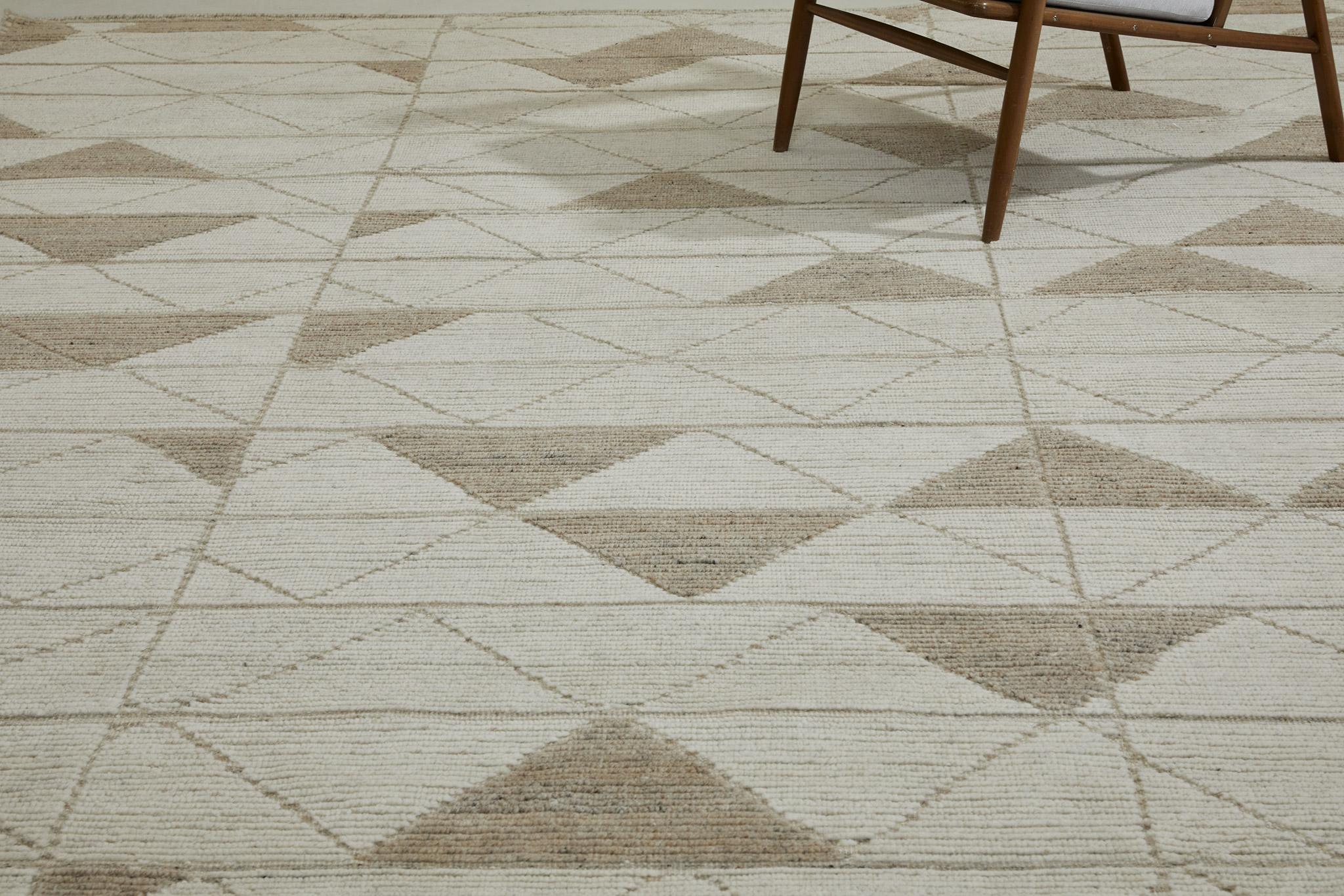 Pinotage’s triangle riff plays out in trim pile with contrasting flatweave lines.

Here in ivory with taupe accents.

The Estancia Collection by Mehraban is a group of casually sophisticated rugs in a versatile array of upbeat colorways and design