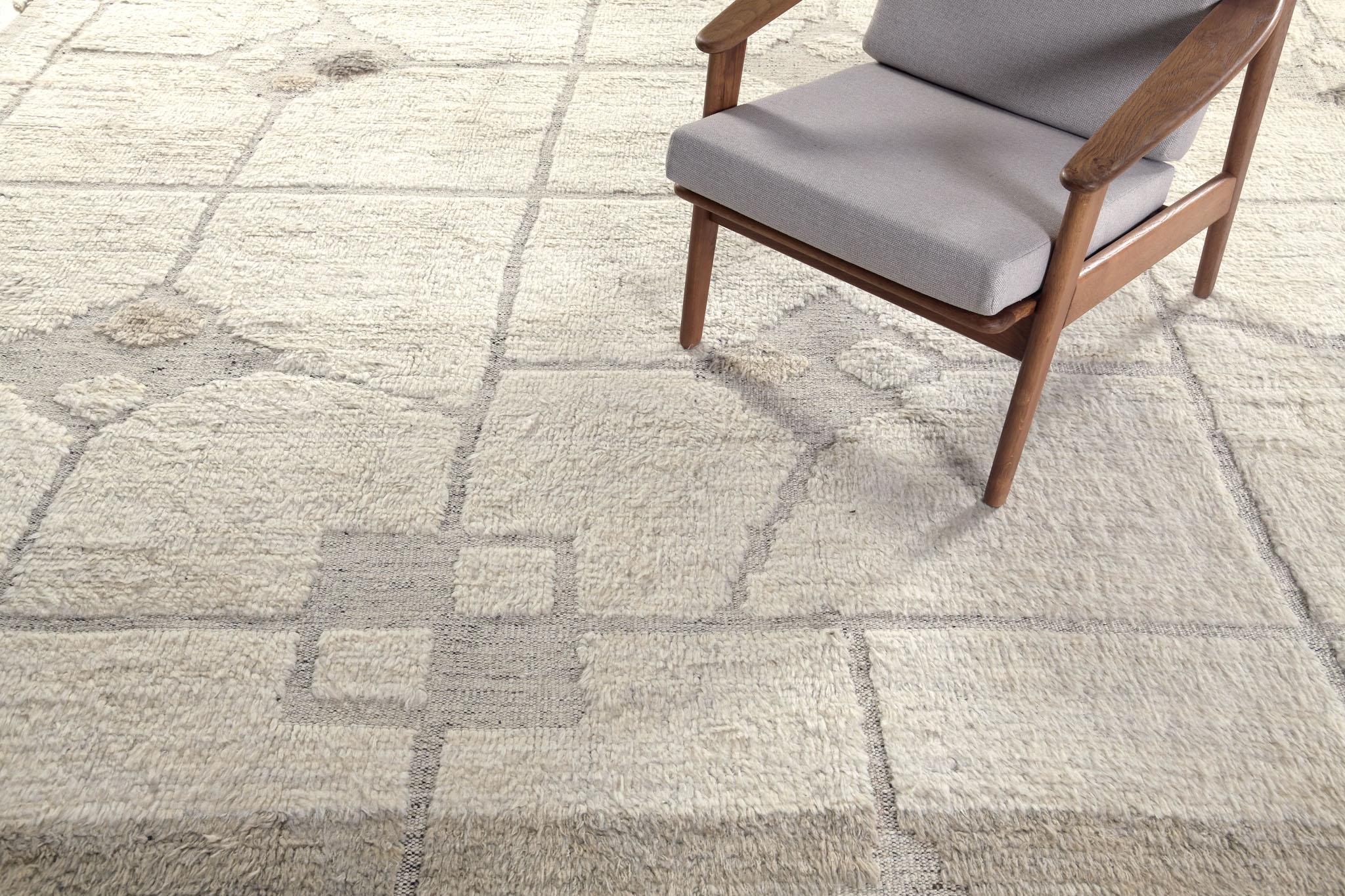 Pirouette is a mesmerizing rug that features a stunning natural color scheme displaying an array of wonderful symbolical motifs and grid patterns. Ivory and light brown play an integral part in illuminating the rug’s overall majestic appearance.