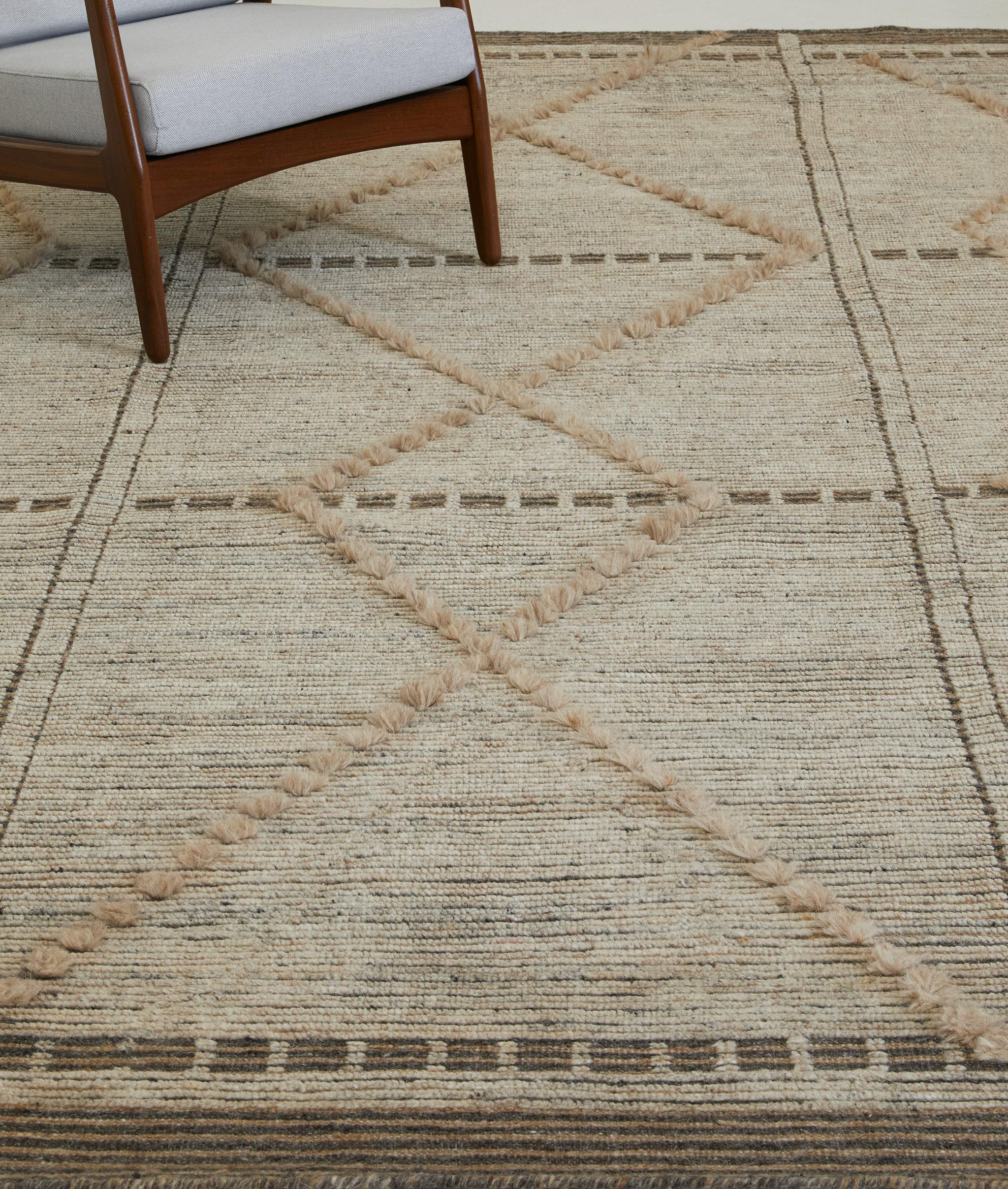 A Moroccan inspired design with formal resolve. Sangiovese's trim pile hosts a classic diamond trellis motif. Contrasting flatweave accents ground the composition.

Here in dappled clay.

The Estancia Collection by Mehraban is a group of casually