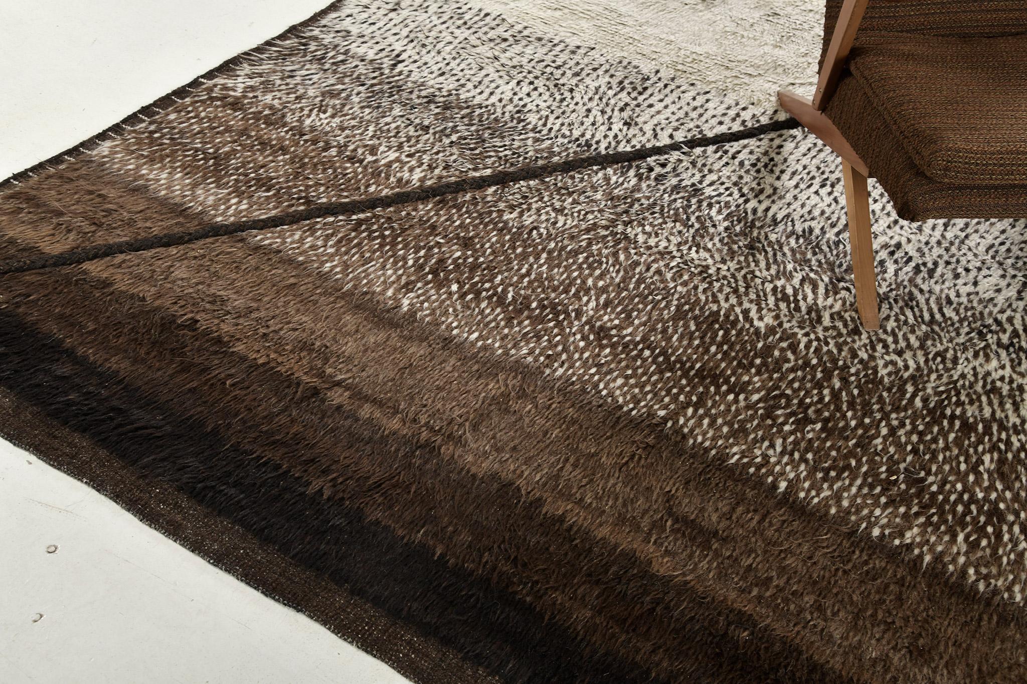 Sebta is an interplay between neutral tones and soothing shades in gradient tones in a modern-day interpretation of the Moroccan world. This rug's play of textures, linework, and simplicity is what makes the Atlas Collection so extraordinary and