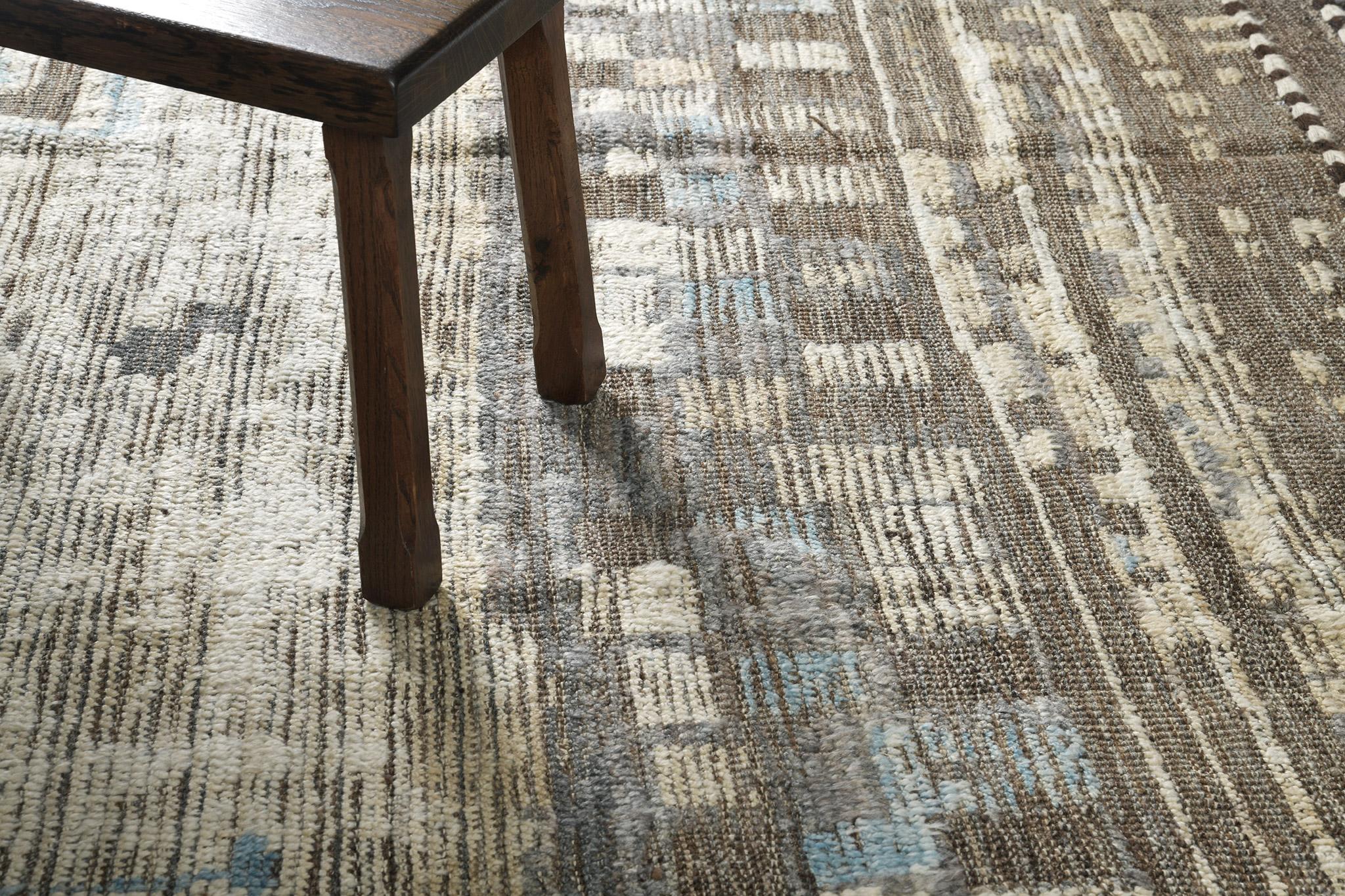 Sissima’ features ambiguous shapes and motifs highlighting the rug’s character. Rendered in the soothing earthy shades of beige, cedar, cerulean blue and taupe, this captivating rug will surely add sophistication to any interior. Mehraban's Atlas