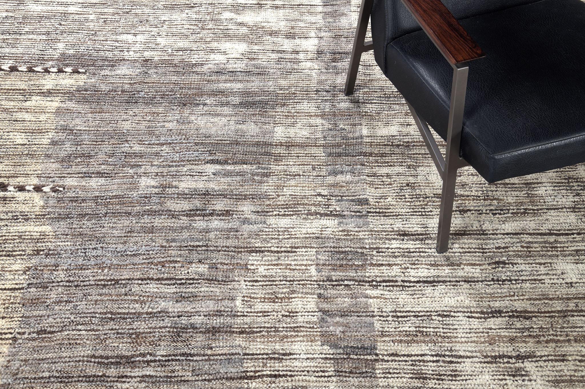 Sittima is an interplay between neutral tones and soothing earth colors in a modern-day interpretation of the Moroccan world. This rug's play of textures, linework, and simplicity is what makes the Atlas Collection so unique and sought after.
