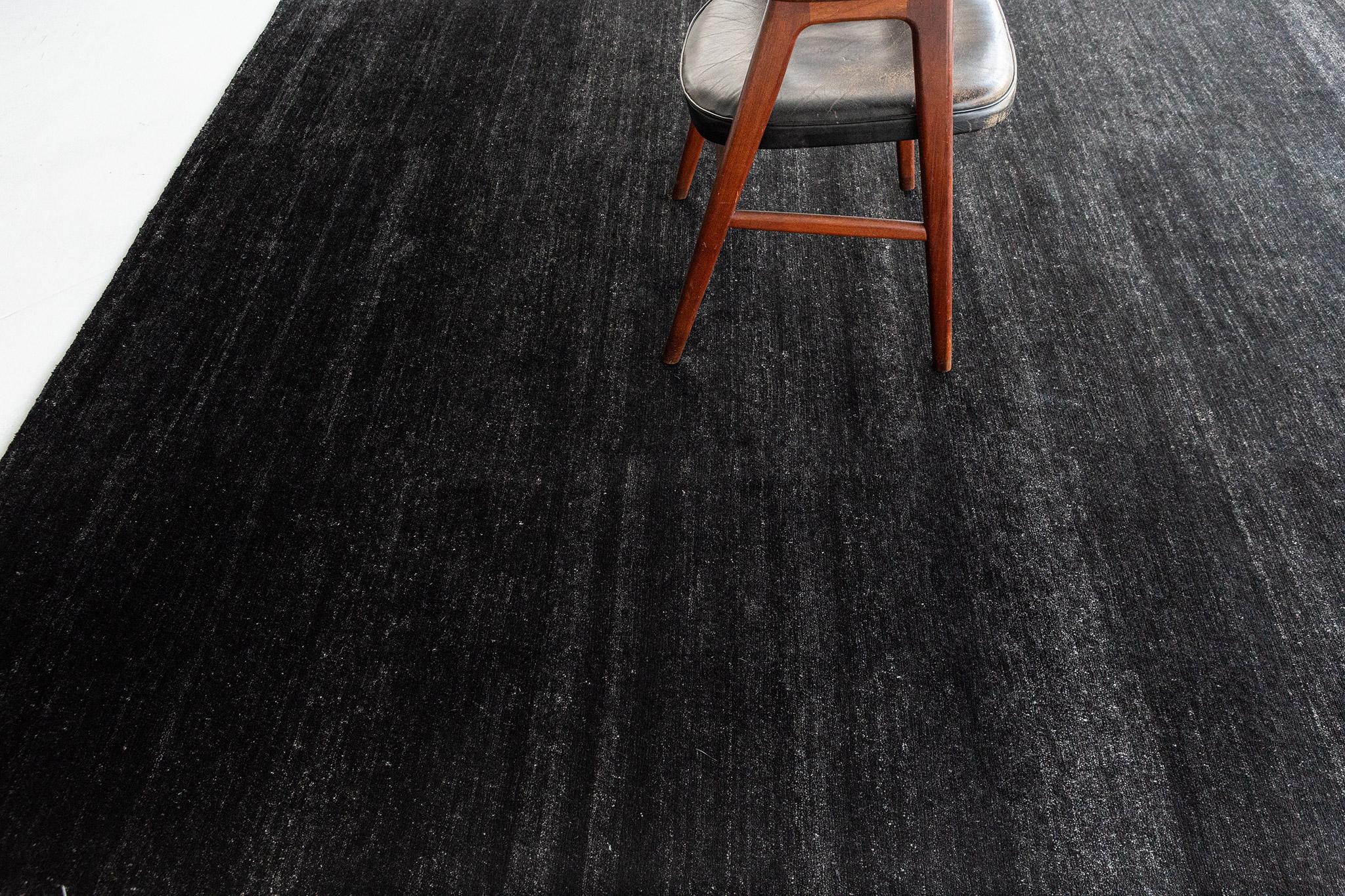 Dara' is a solid bamboo silk rug in the perfect black tone. Its simplicity does not take away from the rug's luxurious quality and beautiful sheen. Dara is a splendid rug for any design space.

Rug Number
20287
Size
7' 9