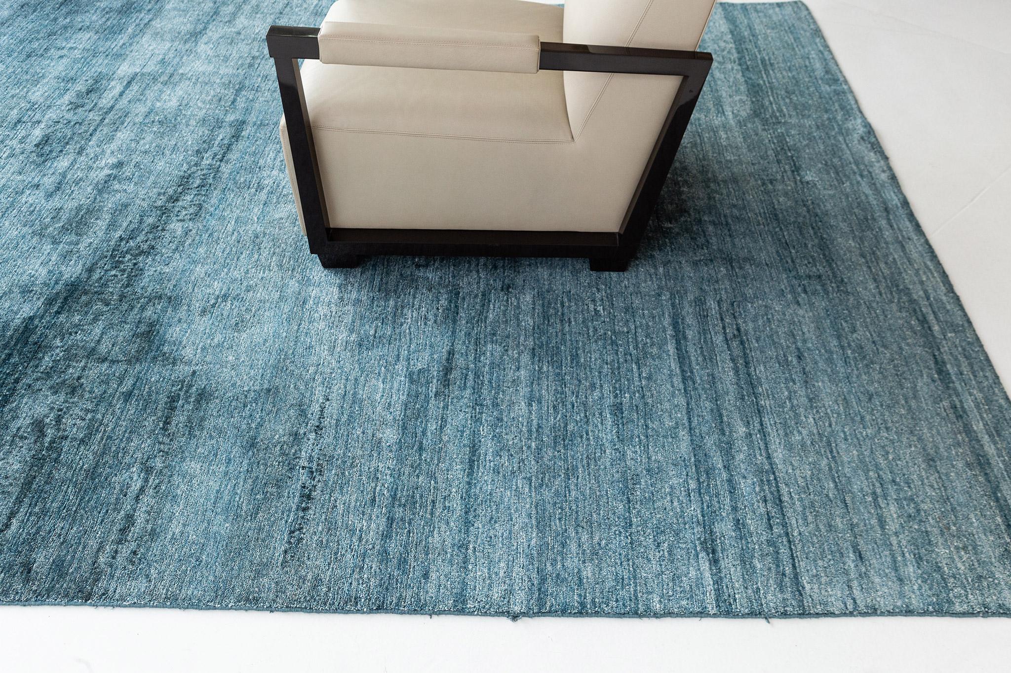 Dara' is a solid bamboo silk rug in the stunning vibrant blue green tones. Its simplicity does not take away from the rug's luxurious quality and beautiful sheen. Dara is a splendid rug for any design space.\

Rug Number
24591
Size
7' 11