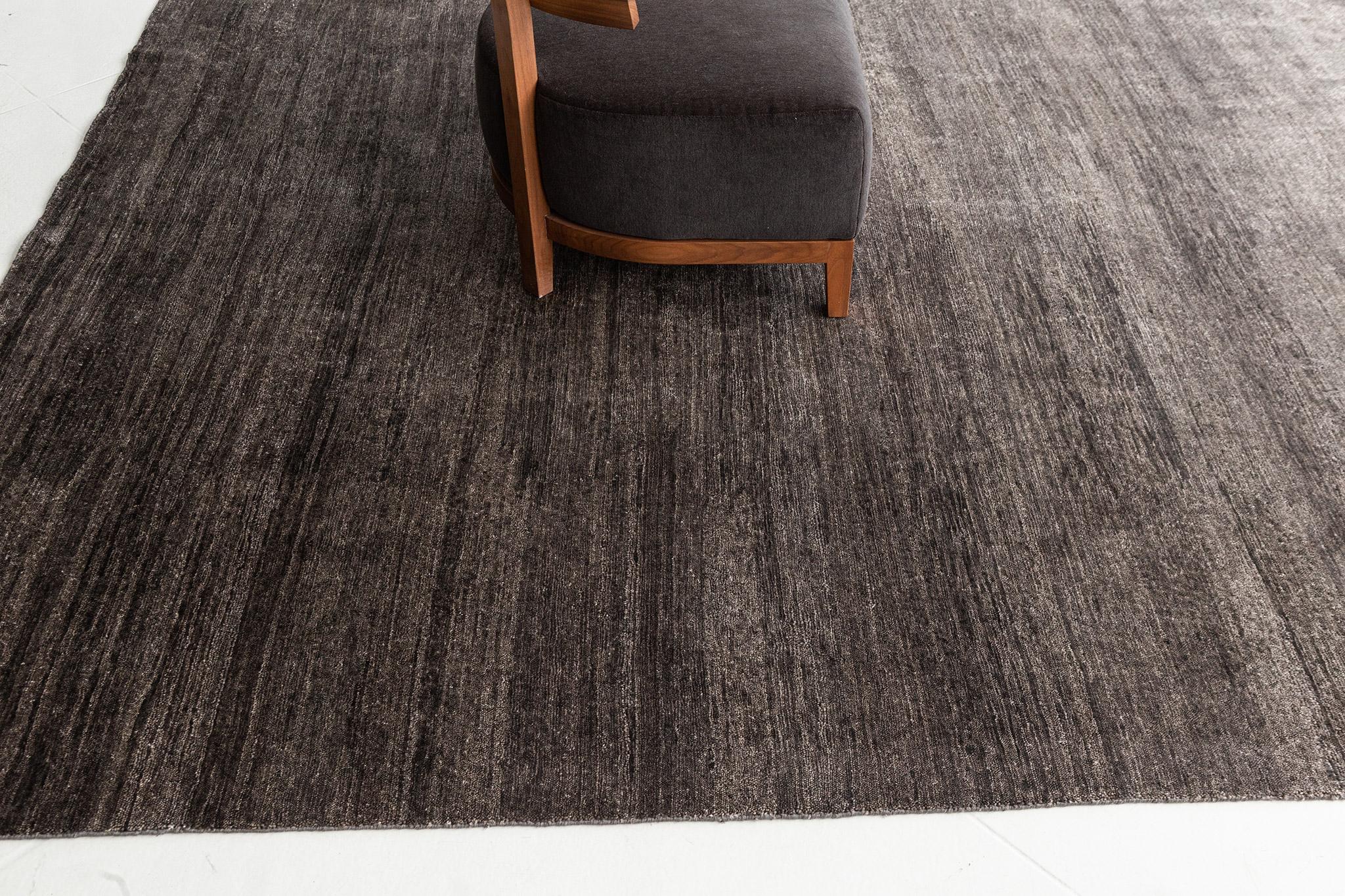 Dara' is a solid bamboo silk rug in stunning charcoal tones. Its simplicity does not take away from the rug's luxurious quality and beautiful sheen. Dara is a splendid rug for any design space.

Rug Number
25938
Size
7' 11