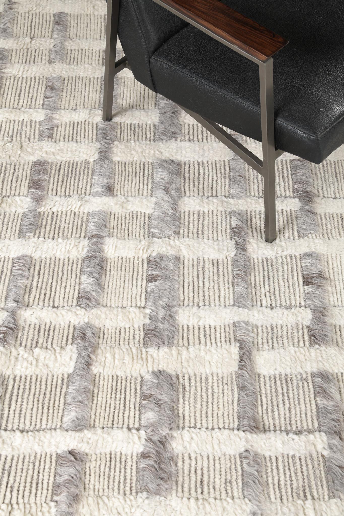Stork is a contemporary design of embossed grid lines that reveals the fashion and versatility of this masterpiece. Stunning grayscale wool will complement any color scheme for every designer's creativity. Sandpiper collection designed in Los